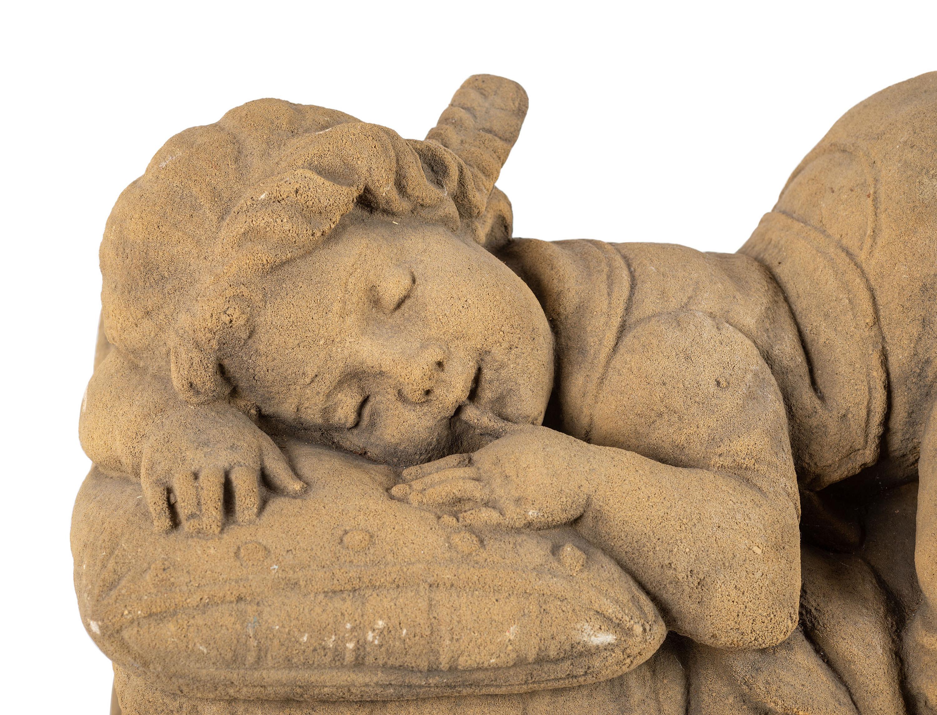 A Concrete Garden Sculpture of a Sleeping Girl