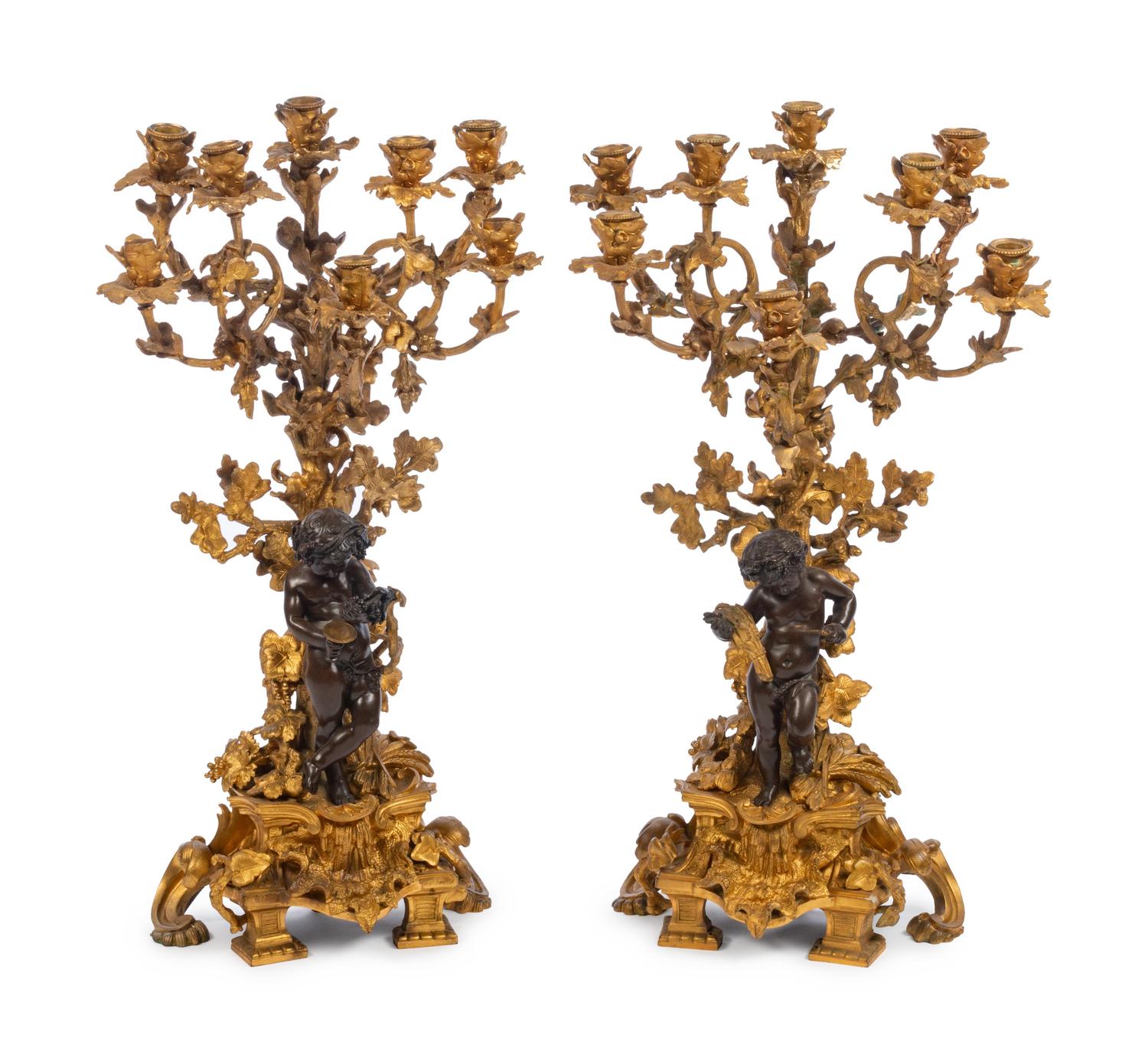 A Pair of French Gilt and Patinated Bronze Eight-Light Figural Candelabra