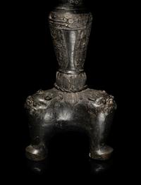 A Large Pair of Bronze Candle Holders