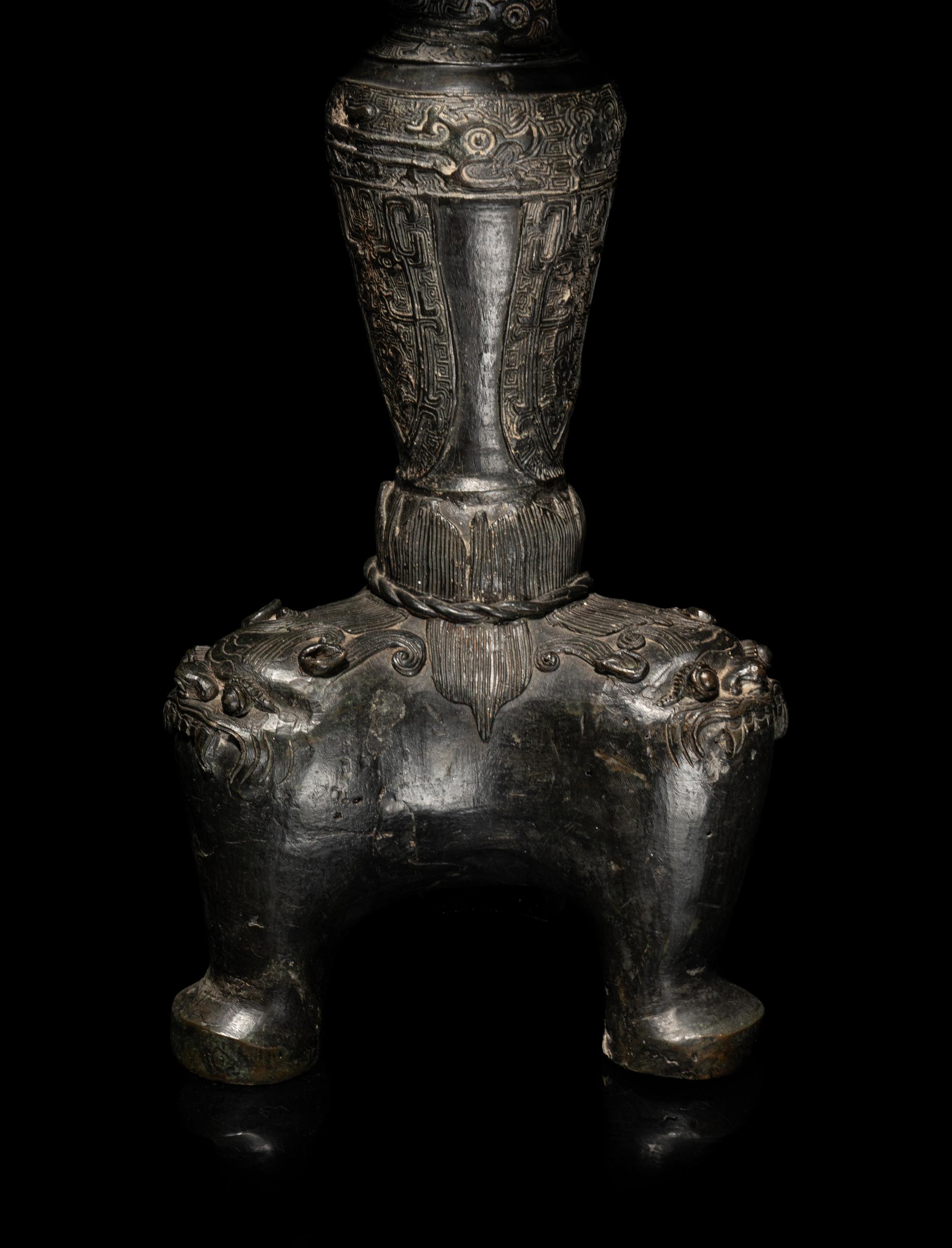 A Large Pair of Bronze Candle Holders
