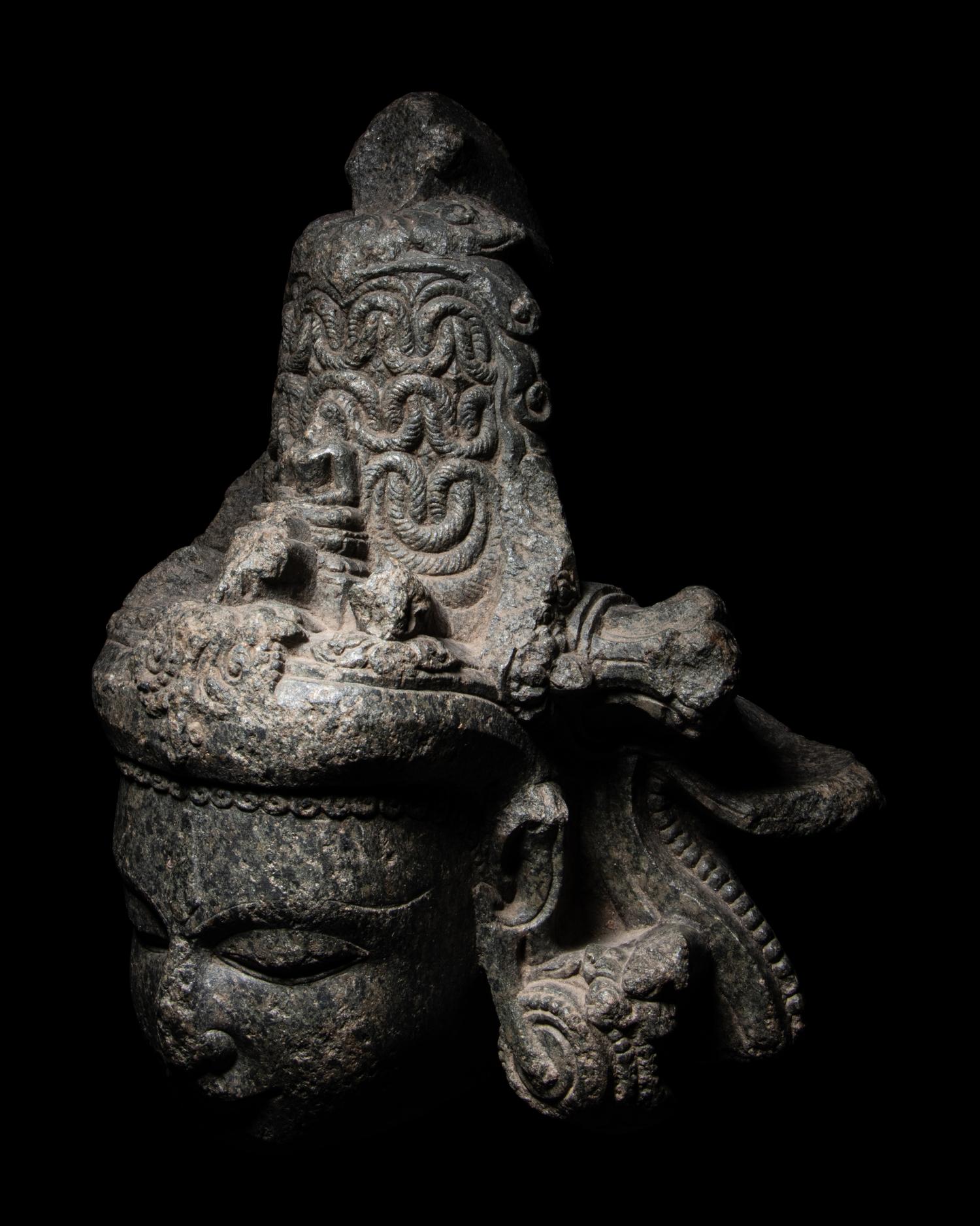 An Indian Carved Black Stone Head of a Vishnu