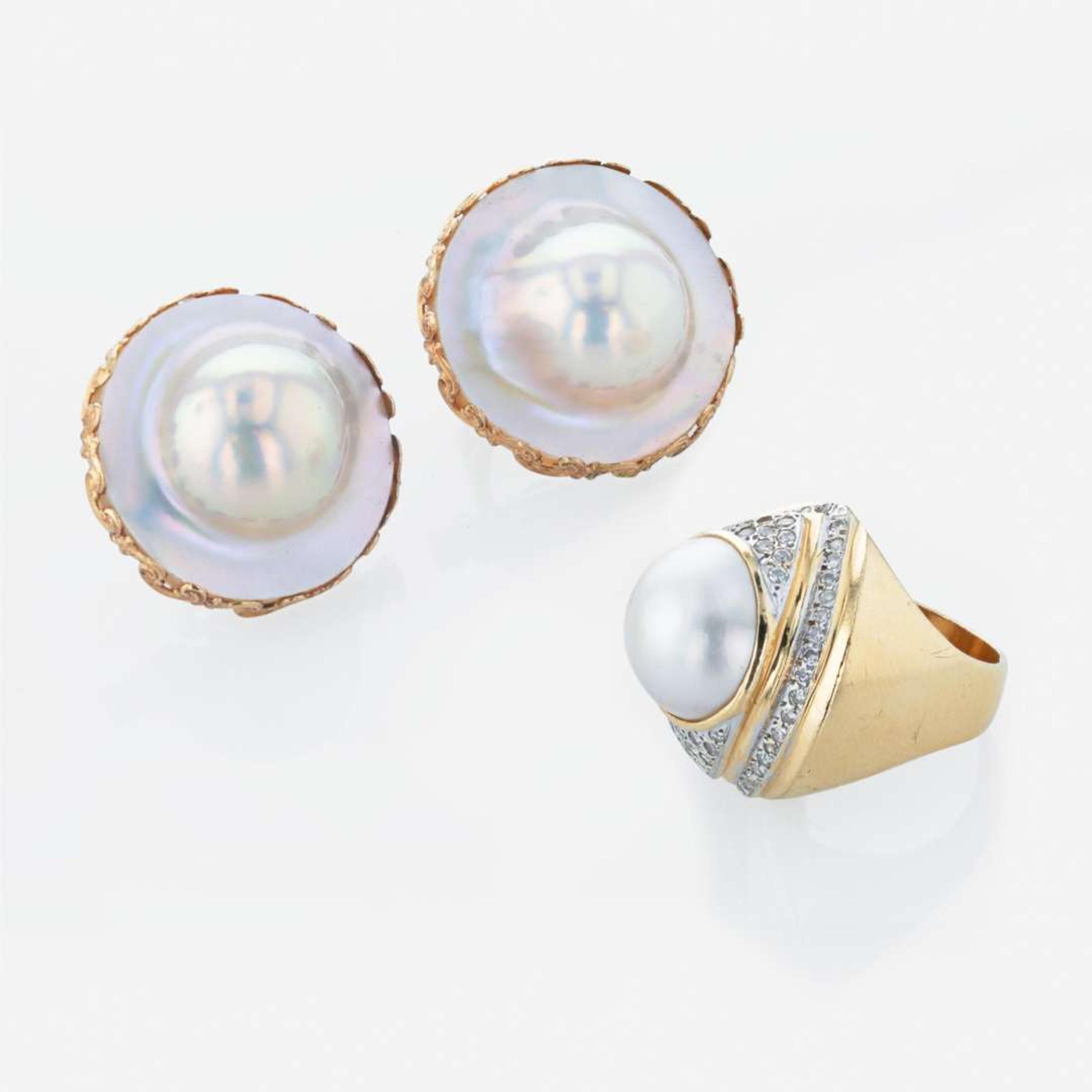 A 14K yellow gold pair of earrings and pearl and diamond ring