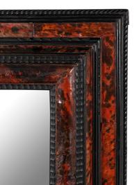 A Dutch Tortoise Shell Veneered and Ripple-Molded Ebonized Mirror