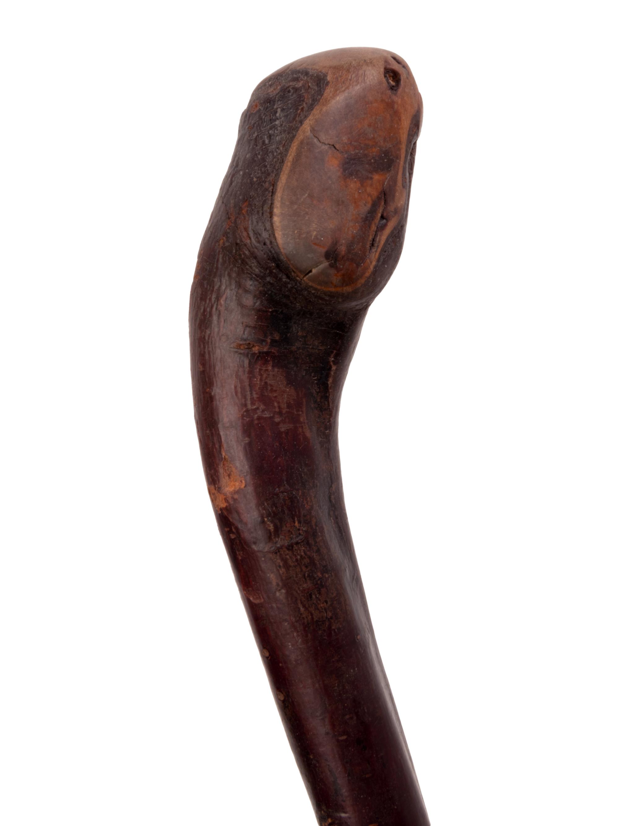 A Folk Art Snake and Alligator Carved Walking Stick