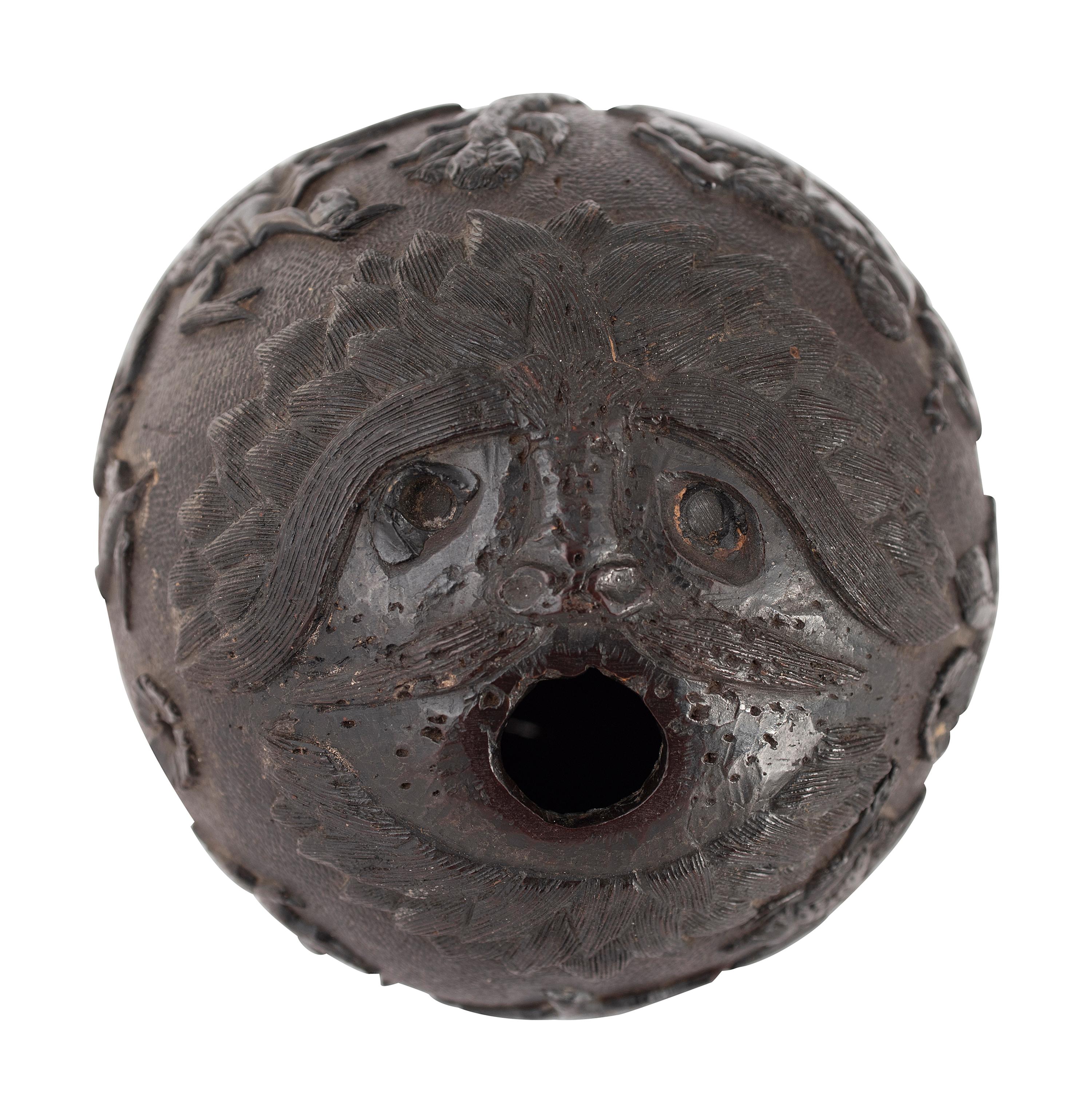 A Carved Coconut Depicting a Grisly American Indian Scene