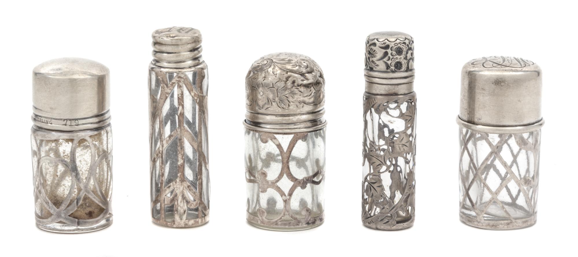 A Group Five Silver Overlay Glass Scent Bottles Height of tallest 2 5/8 inches.