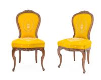 A Set of Four Rococo Style Walnut Side Chairs