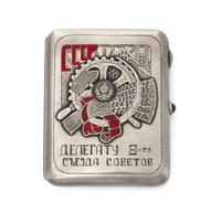 A Soviet Russian Silver and Enamel Cigarette Case, Marked with a Soviet-era Artel stamp, Moscow, the lid centered by the seal of the So