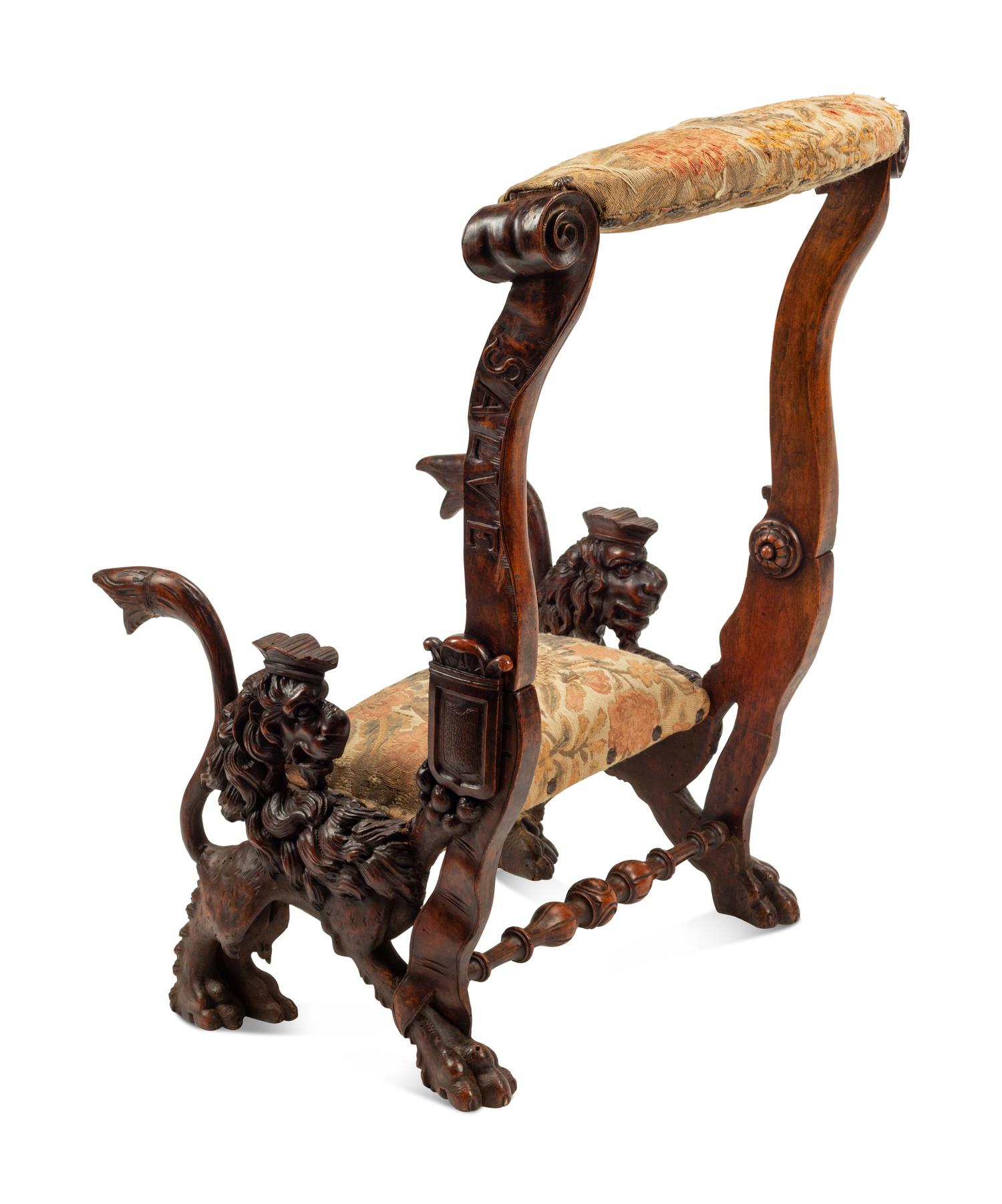 An Italian Carved Walnut Low Armchair