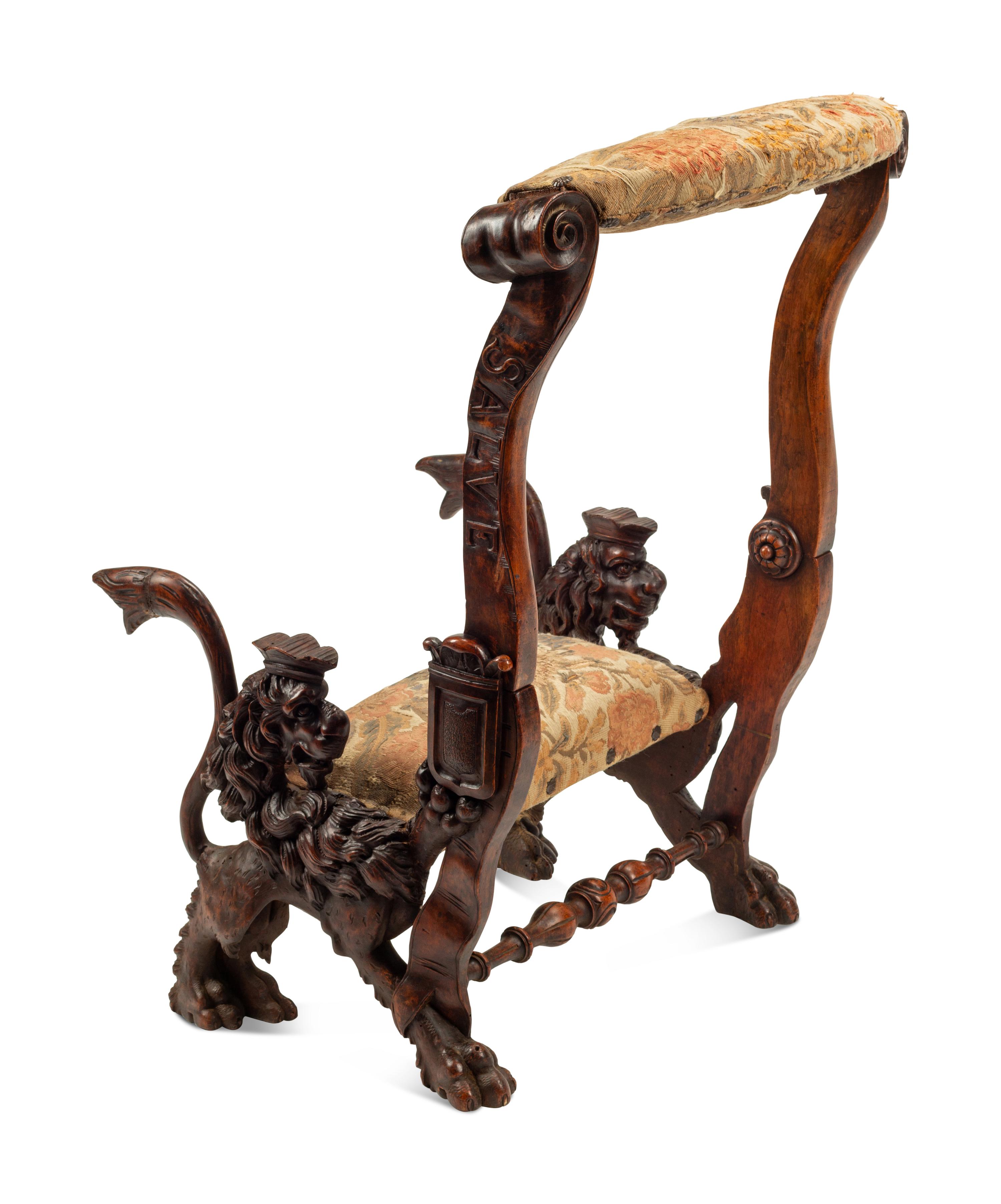 An Italian Carved Walnut Low Armchair