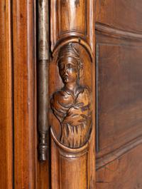 A Louis XV Carved Walnut Armoire