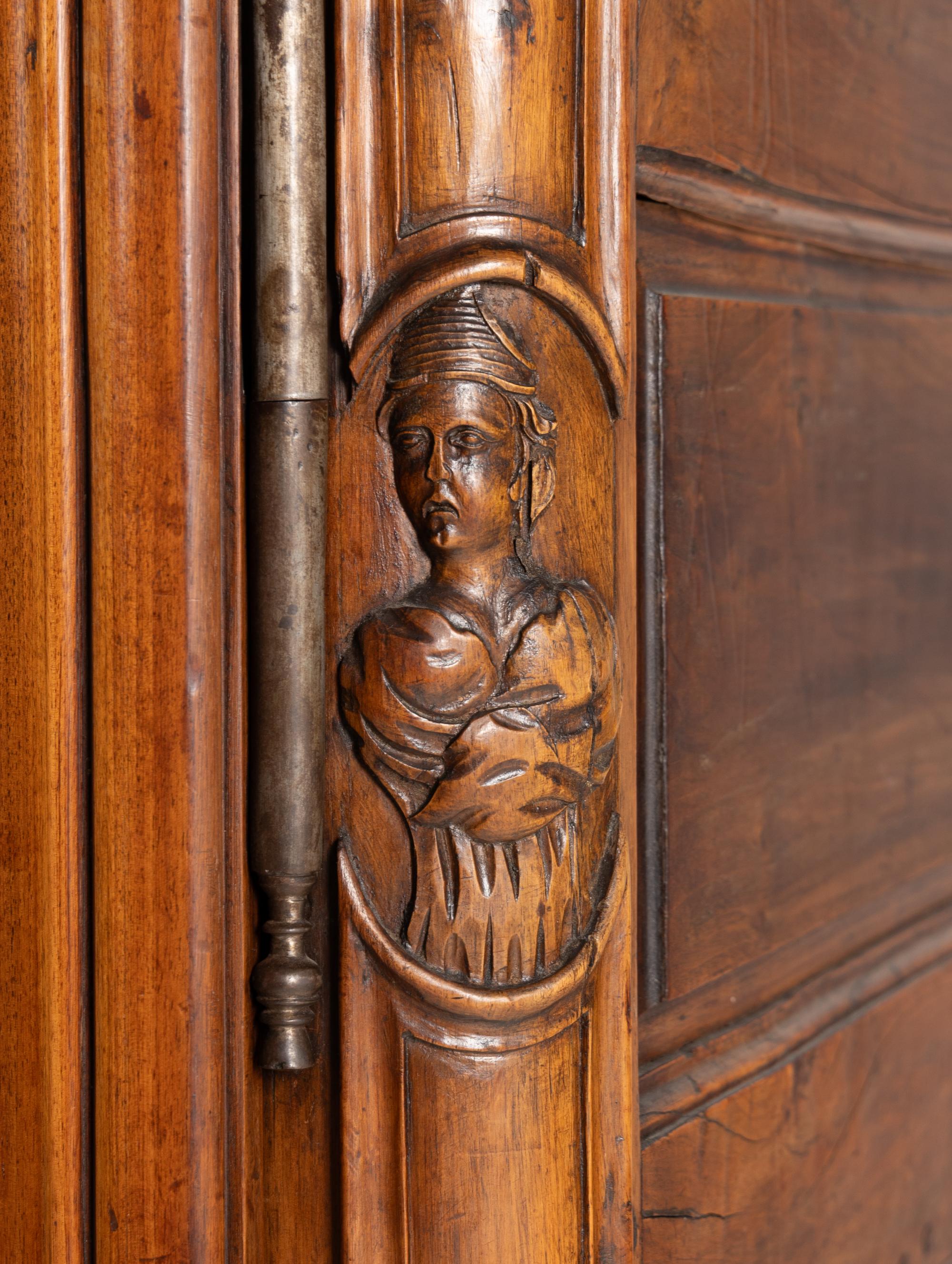 A Louis XV Carved Walnut Armoire