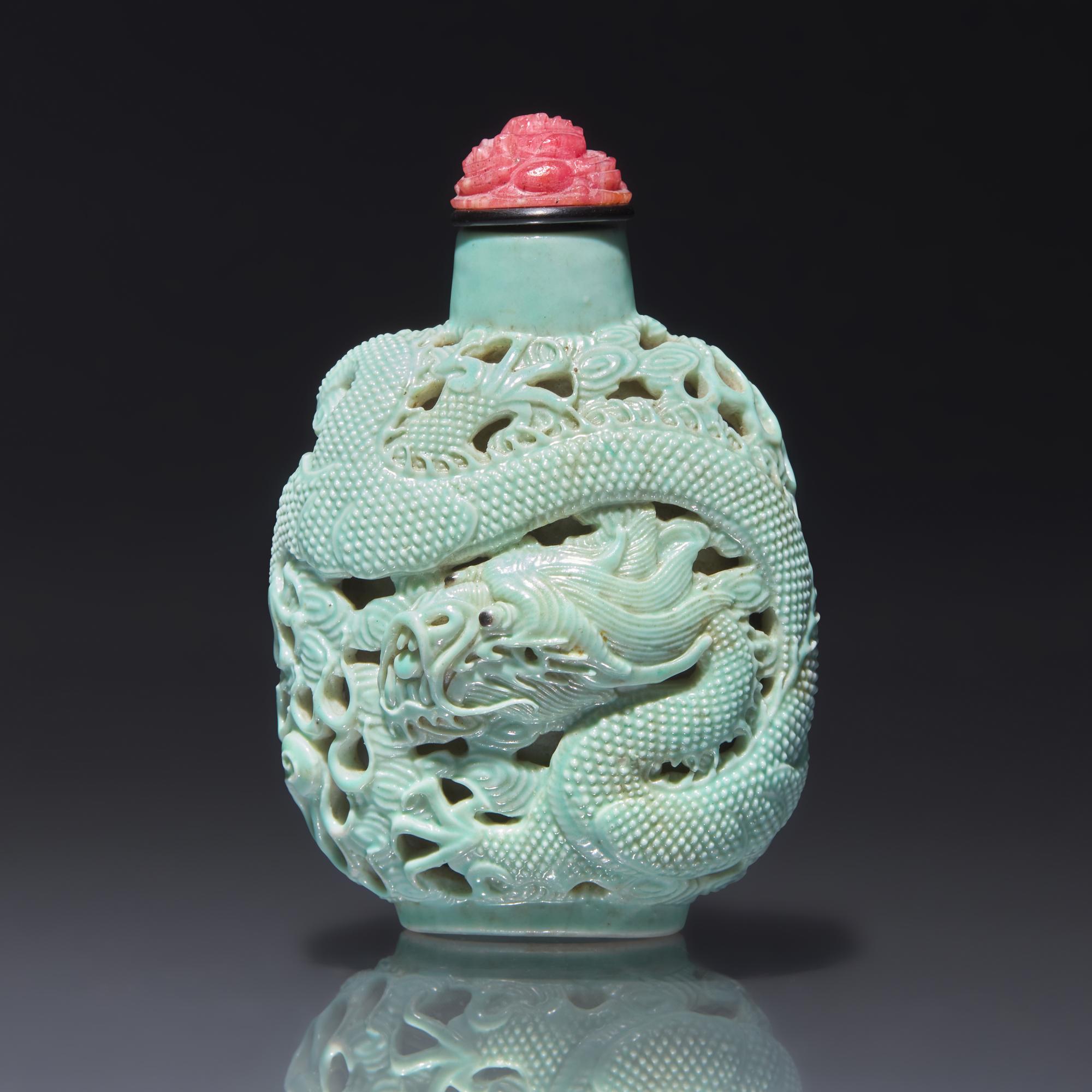 A Chinese Turquoise-Glazed Reticulated Porcelain "Dragon" Snuff Bottle, Qing Dynasty, Second Half 19th Century — 清晚期 松石釉鏤雕龍戲珠圖鼻煙壺