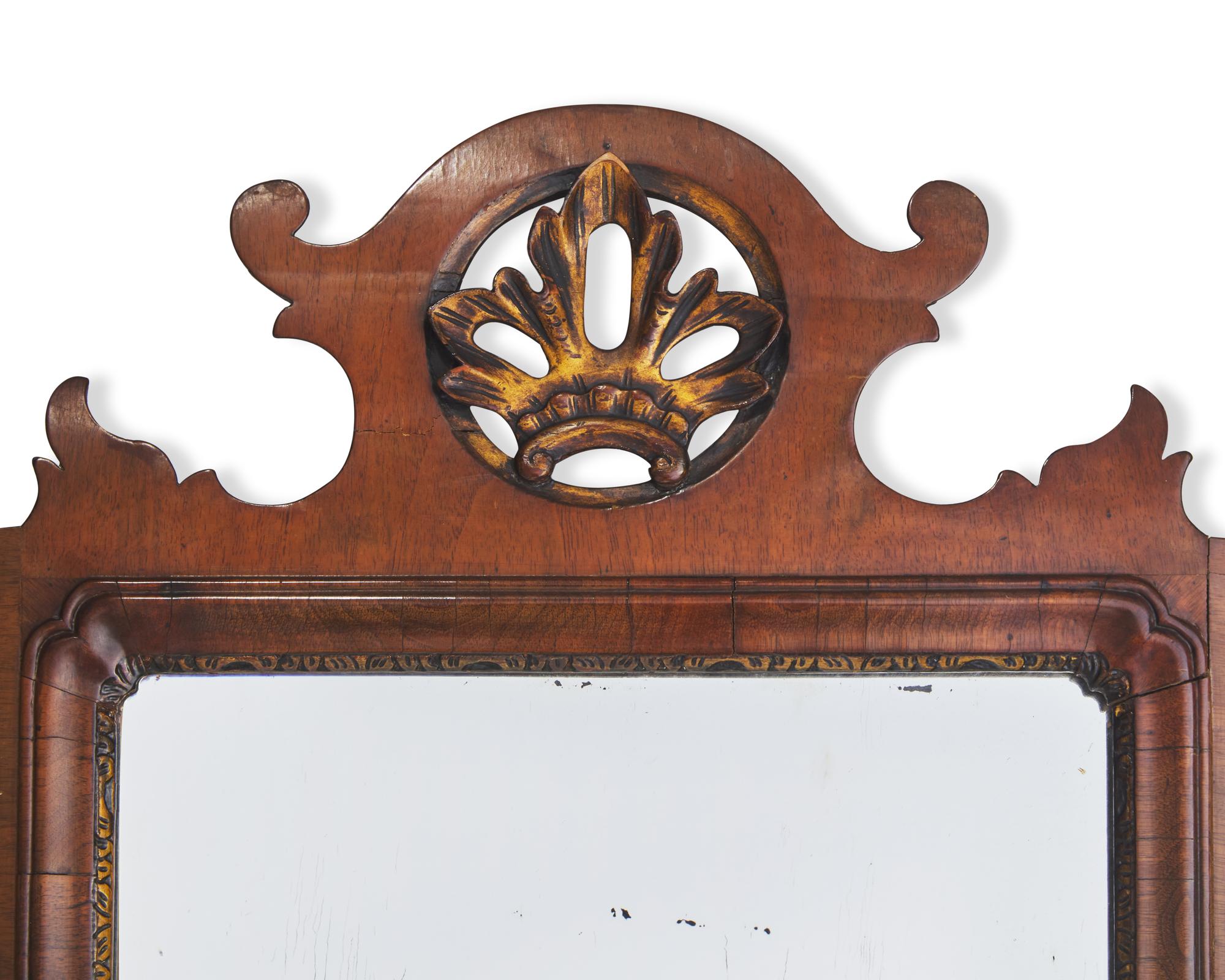 A Chippendale Fret-Carved and Parcel-Gilt and Inlaid Mahogany Mirror