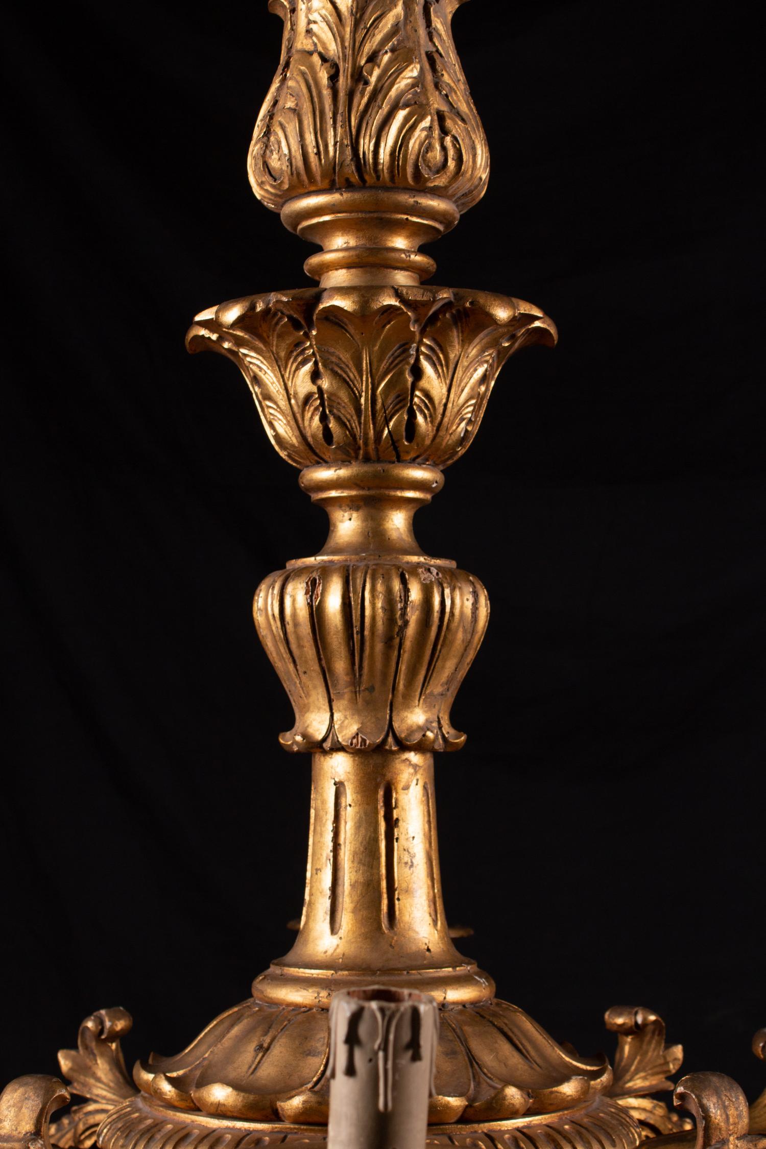 An Italian Rococo Style Giltwood Sixteen-Light Chandelier