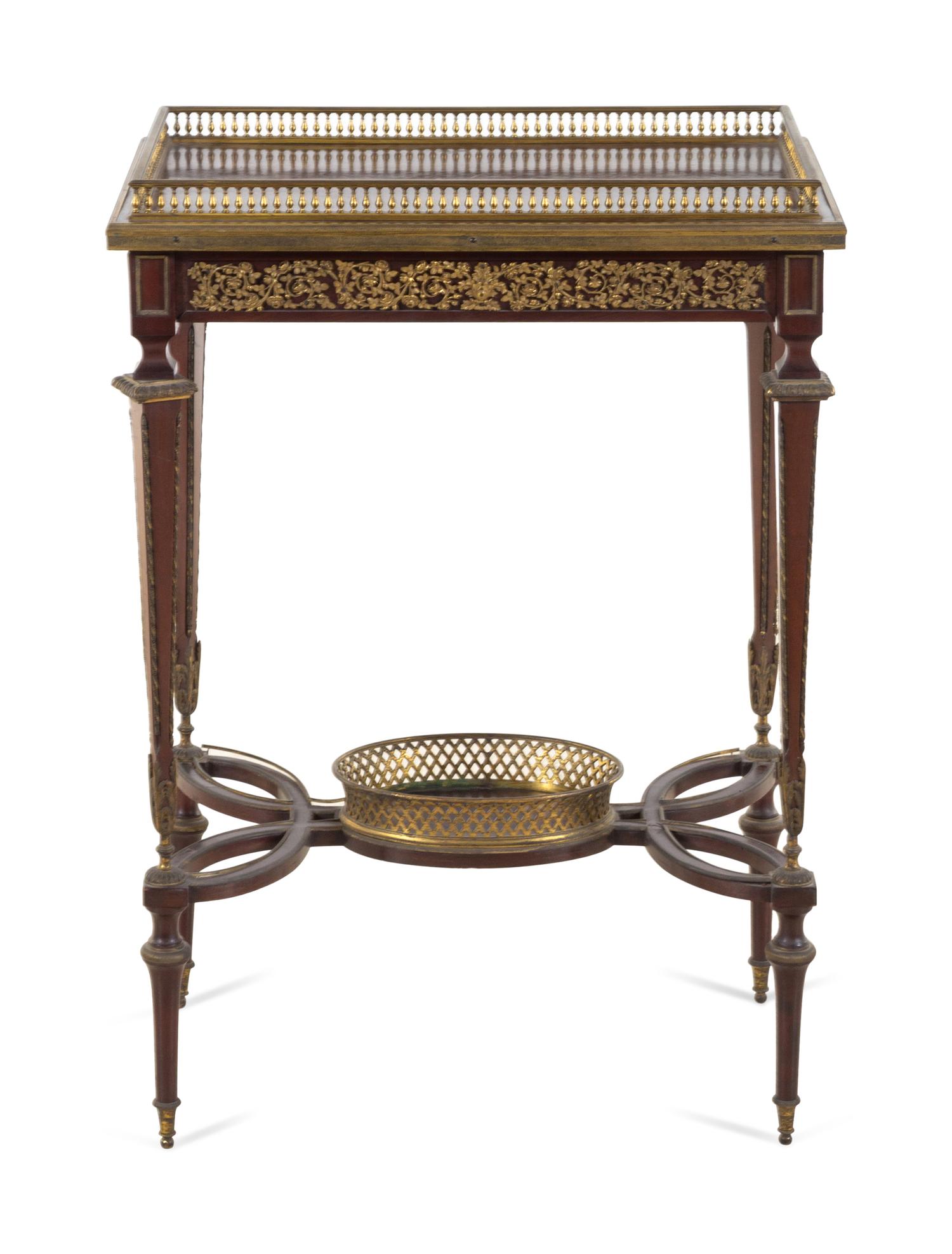A Louis XVI Style Gilt Bronze Mounted Mahogany Table