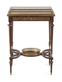 A Louis XVI Style Gilt Bronze Mounted Mahogany Table