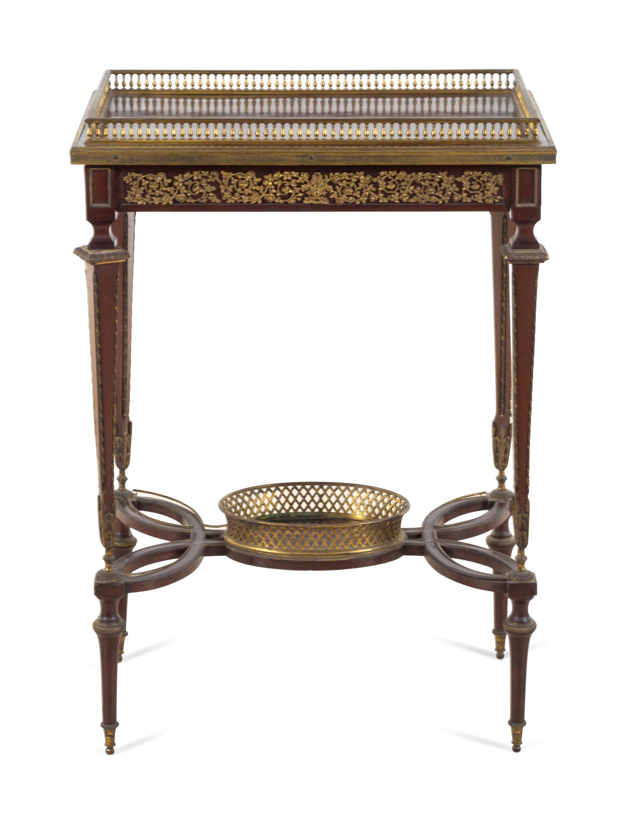 A Louis XVI Style Gilt Bronze Mounted Mahogany Table