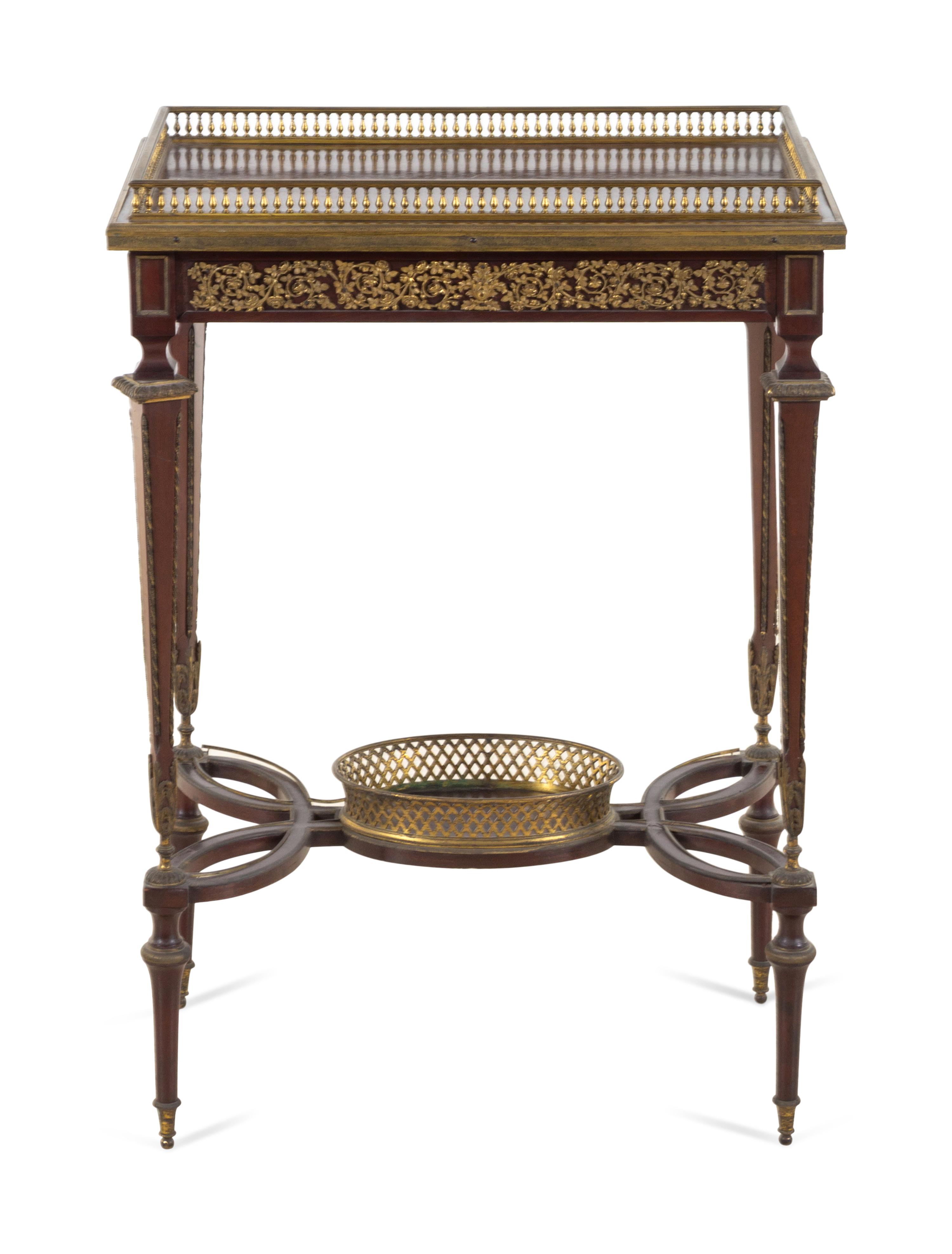 A Louis XVI Style Gilt Bronze Mounted Mahogany Table