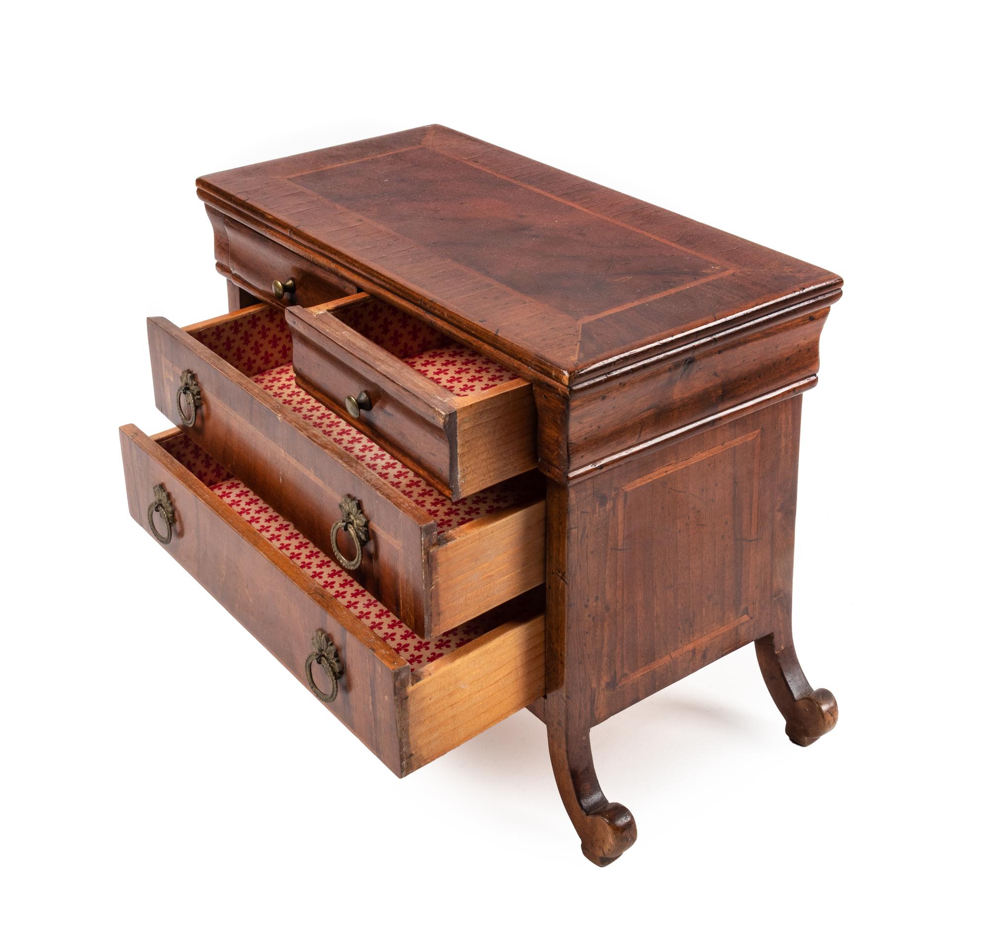 An Italian Walnut Diminutive Chest