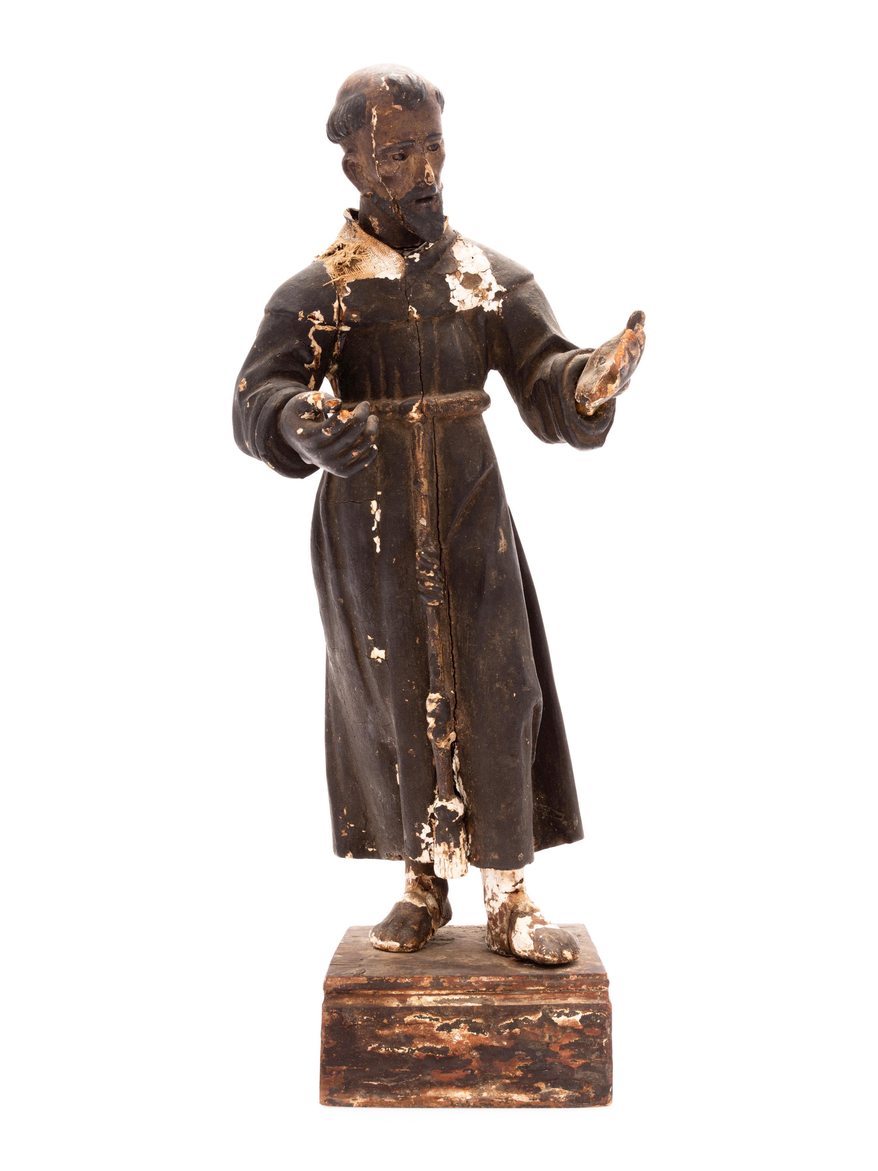 A Spanish Colonial Painted Wood Figure of a Saint