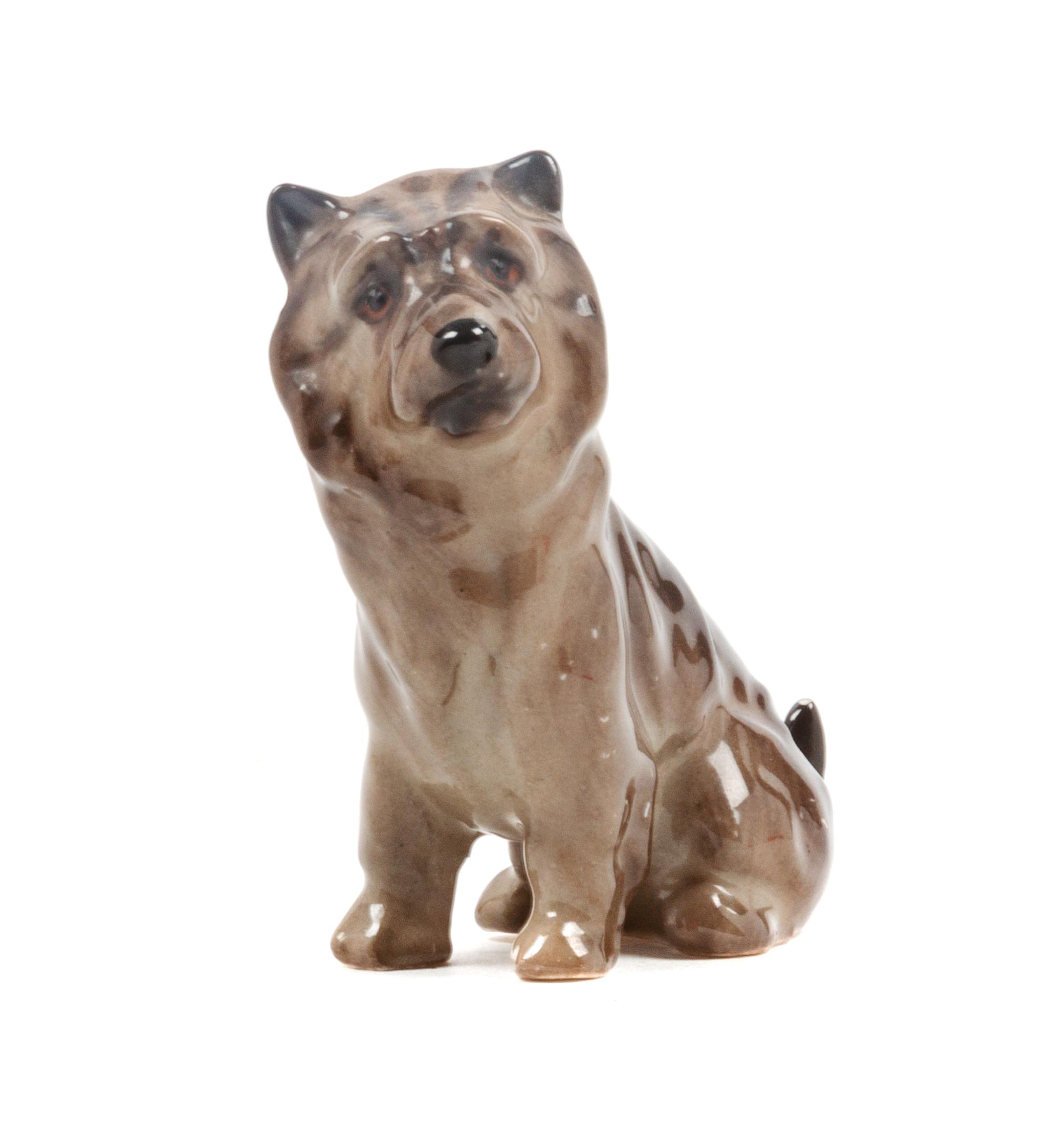 A Royal Doulton Porcelain Cairn Terrier Height 2 1/2 inches.