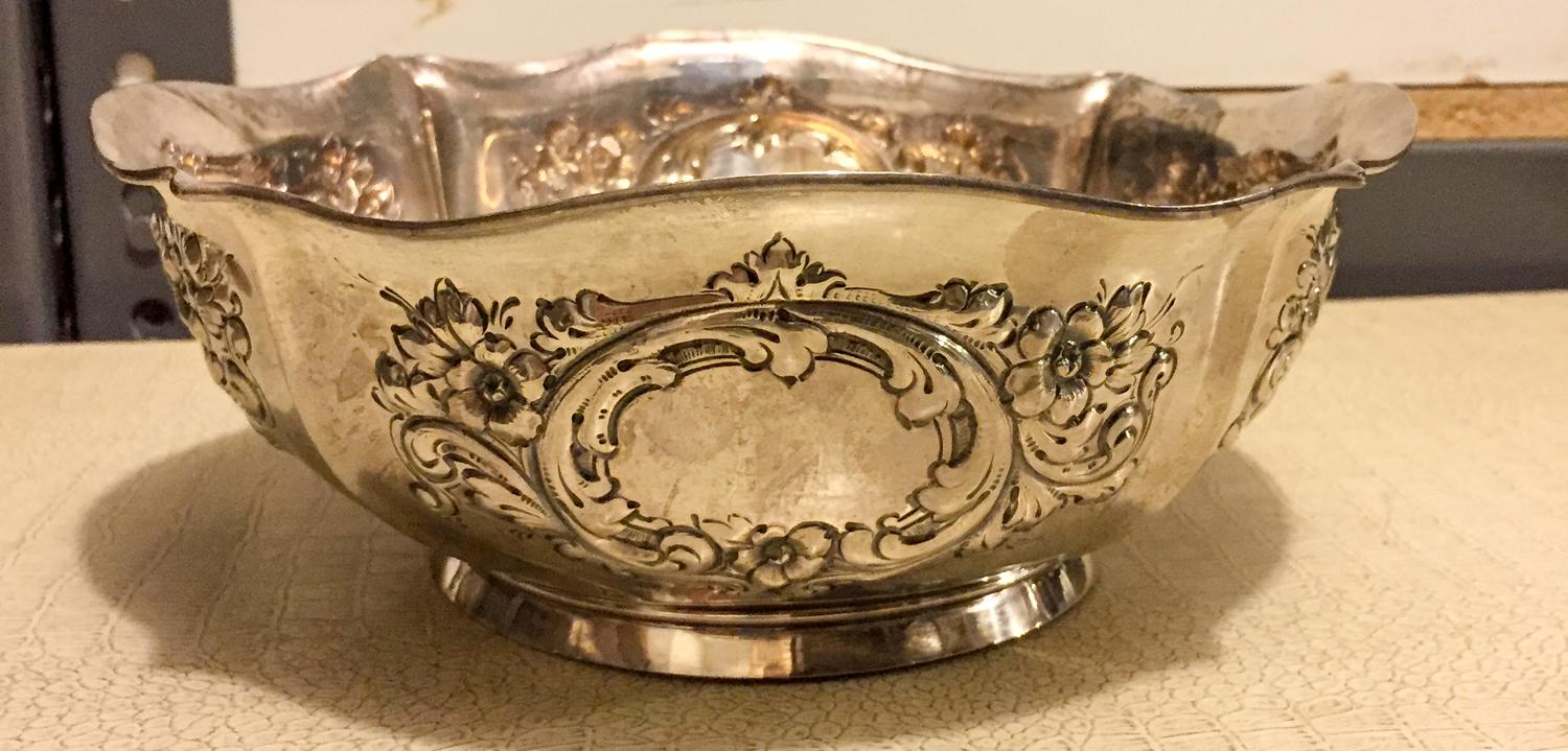 An American Silver Center Bowl, International Silver Co., Meriden, CT, of quatrefoil form, the body worked with foliate volutes and flo