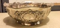 An American Silver Center Bowl, International Silver Co., Meriden, CT, of quatrefoil form, the body worked with foliate volutes and flo