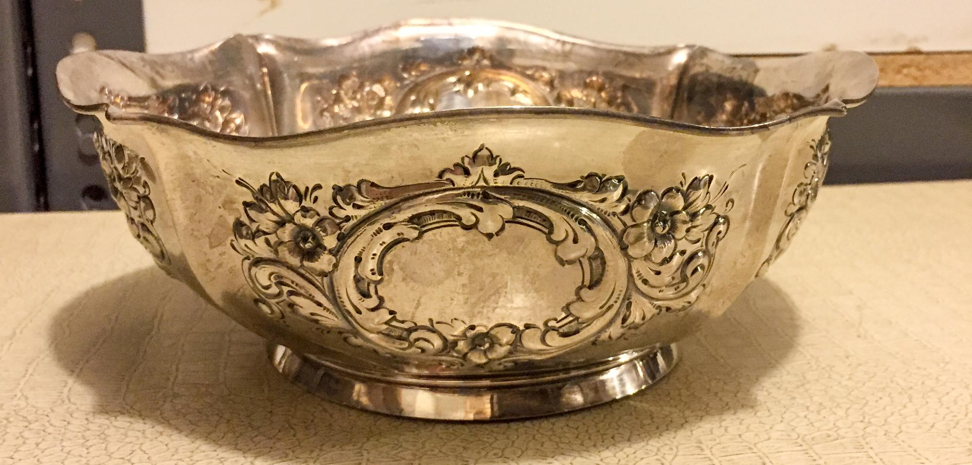 An American Silver Center Bowl, International Silver Co., Meriden, CT, of quatrefoil form, the body worked with foliate volutes and flo