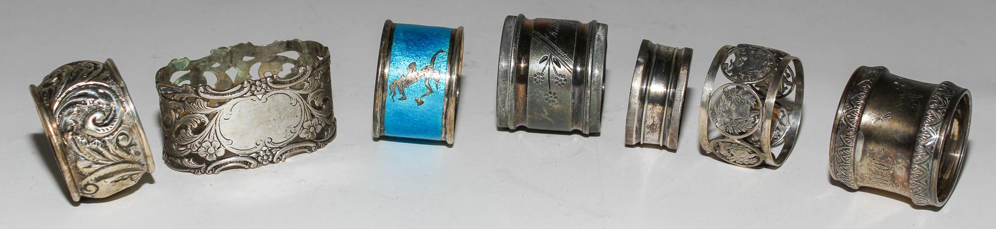 Seven Silver and Silver-Plate Napkin Rings Width of widest 2 1/2 inches. — 19TH/20TH CENTURY