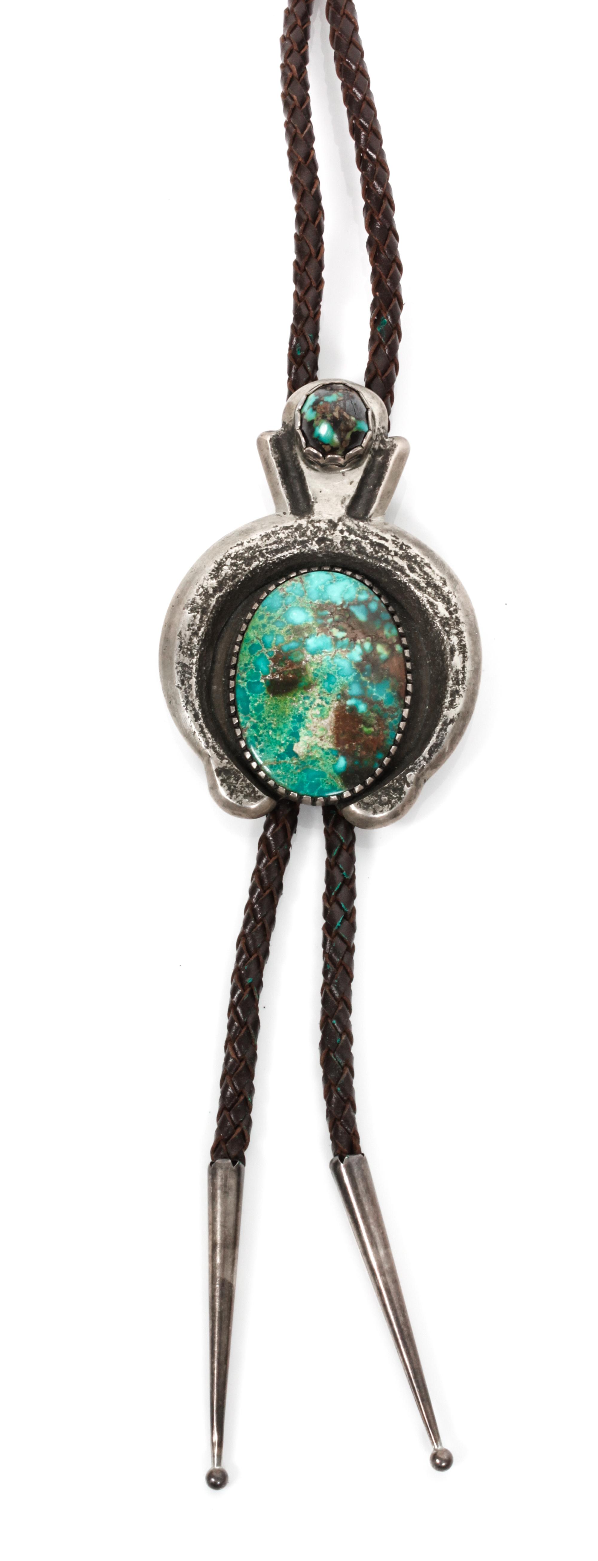A Navajo Silver and Turquoise Bolo, Chester Kahn Height 3 1/4 x width 2 1/4 inches.