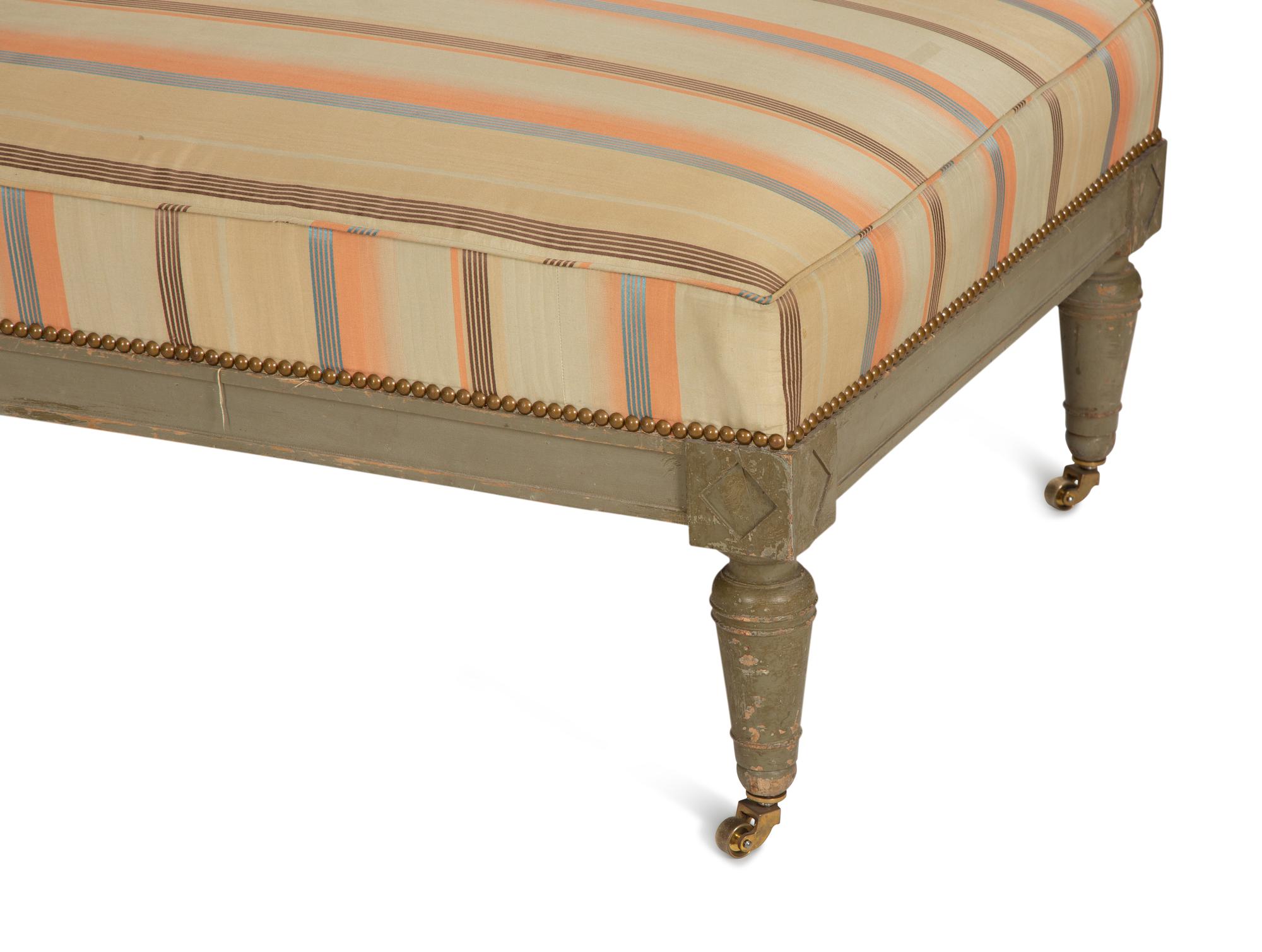 A Gustavian Style Painted and Parcel Gilt Chaise Longue
