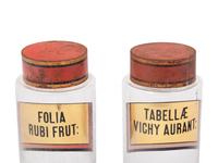 A Pair of Clear Glass Apothecary Jars