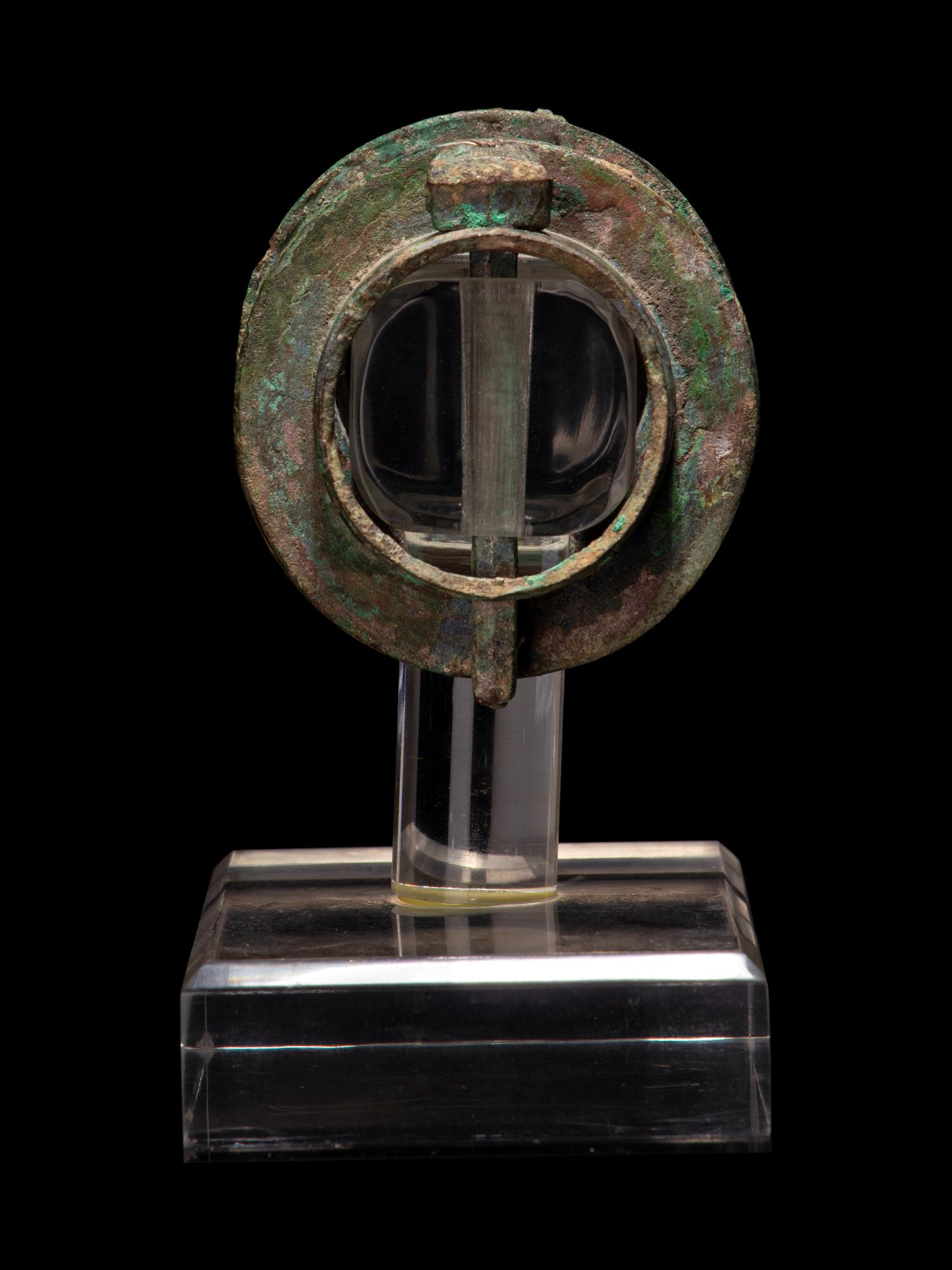 A Pair of Chinese Archaic Bronze Axle Covers and Linchpins