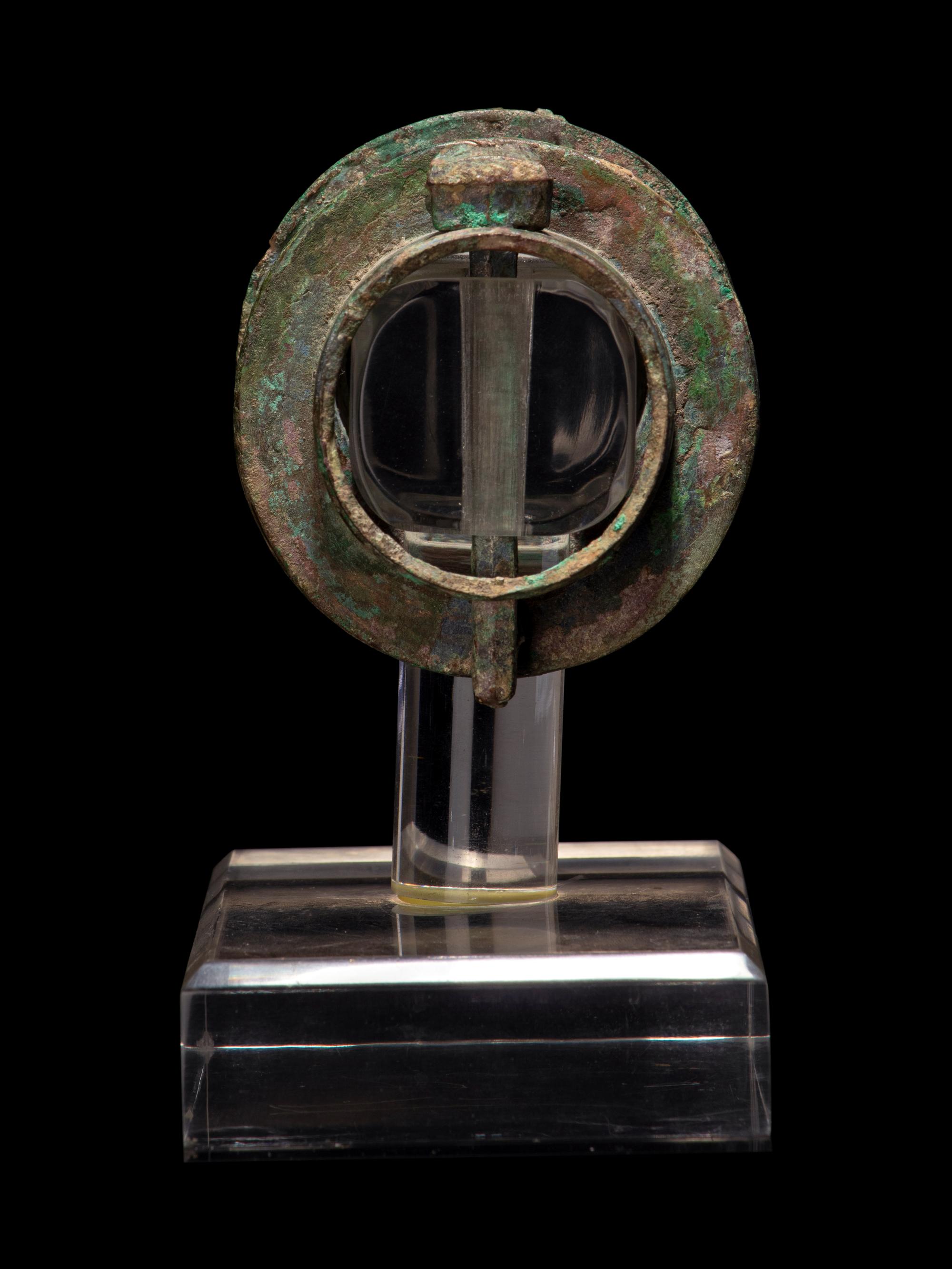 A Pair of Chinese Archaic Bronze Axle Covers and Linchpins
