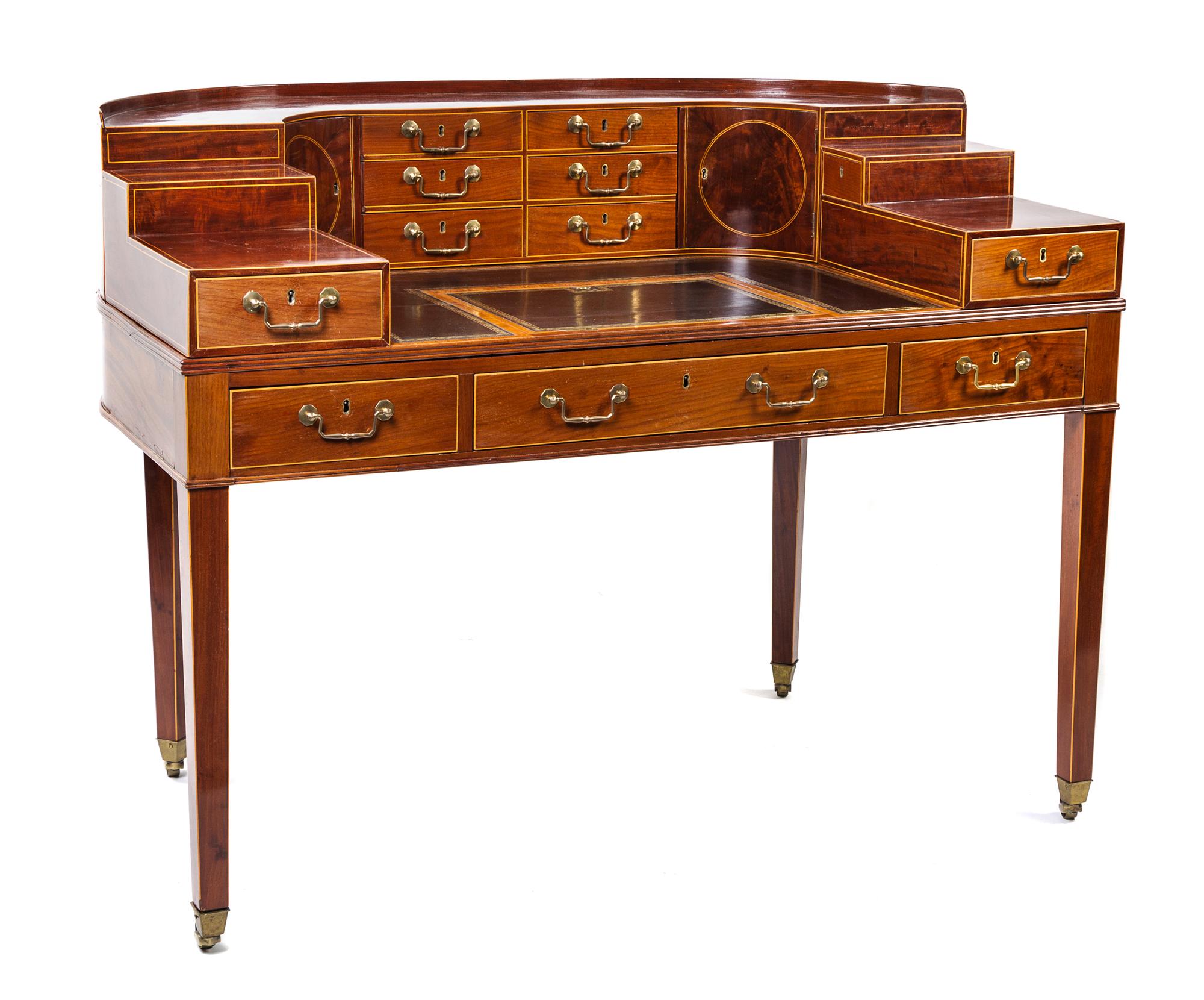A George III Gilt-Tooled Leather-Inset, Inlaid Mahogany and Satinwood-Banded Carlton House Desk Height 41 x width 53 1/2 x depth 33 inc