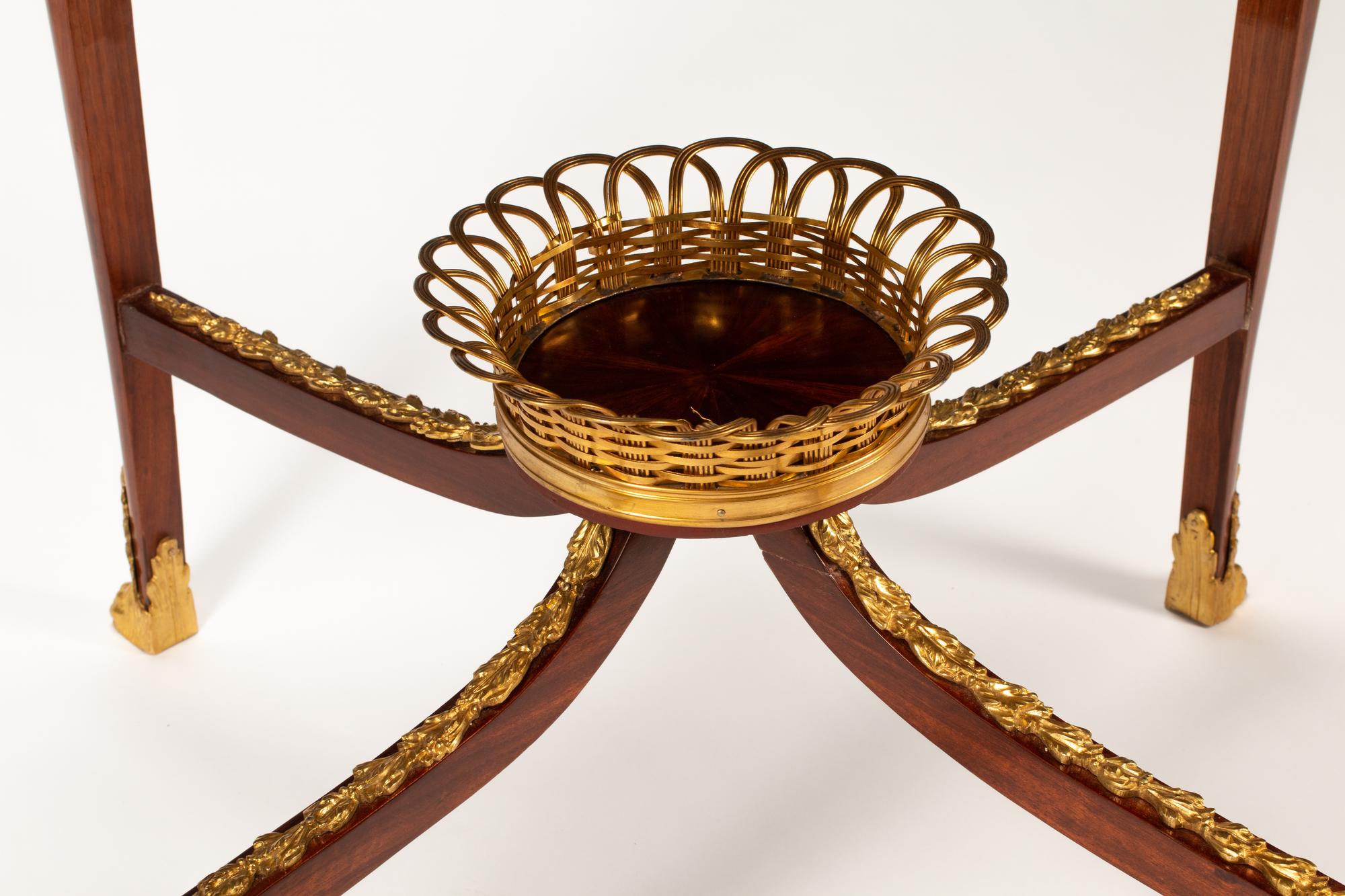 A Louis XV Style Gilt Bronze Mounted Marquetry Table