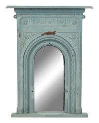 A Patinated Cast Iron Mirror