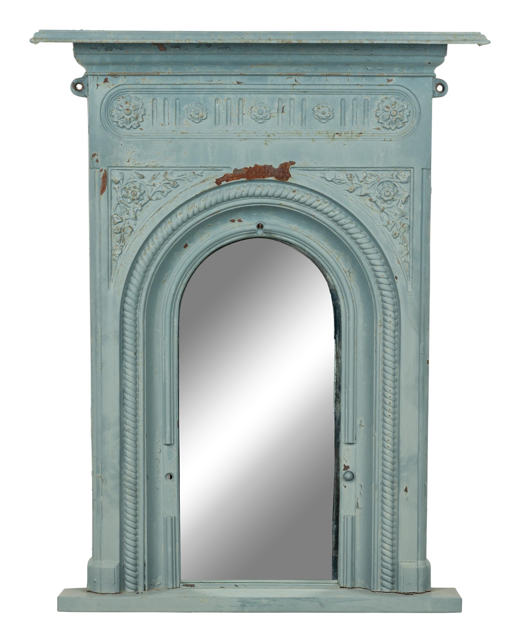 A Patinated Cast Iron Mirror