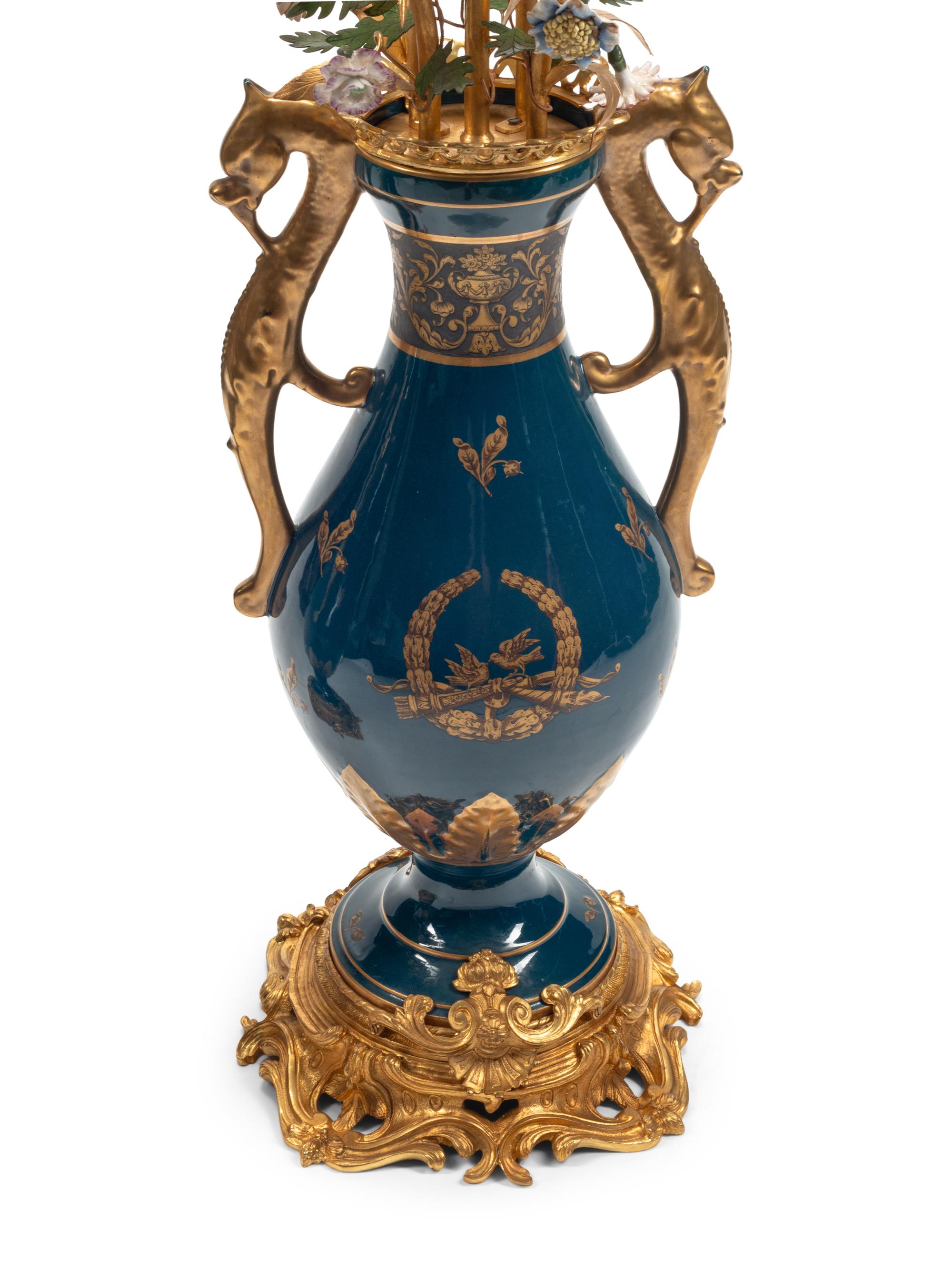 A Pair of Large Continental Gilt Bronze and Porcelain Five-Light Candelabra