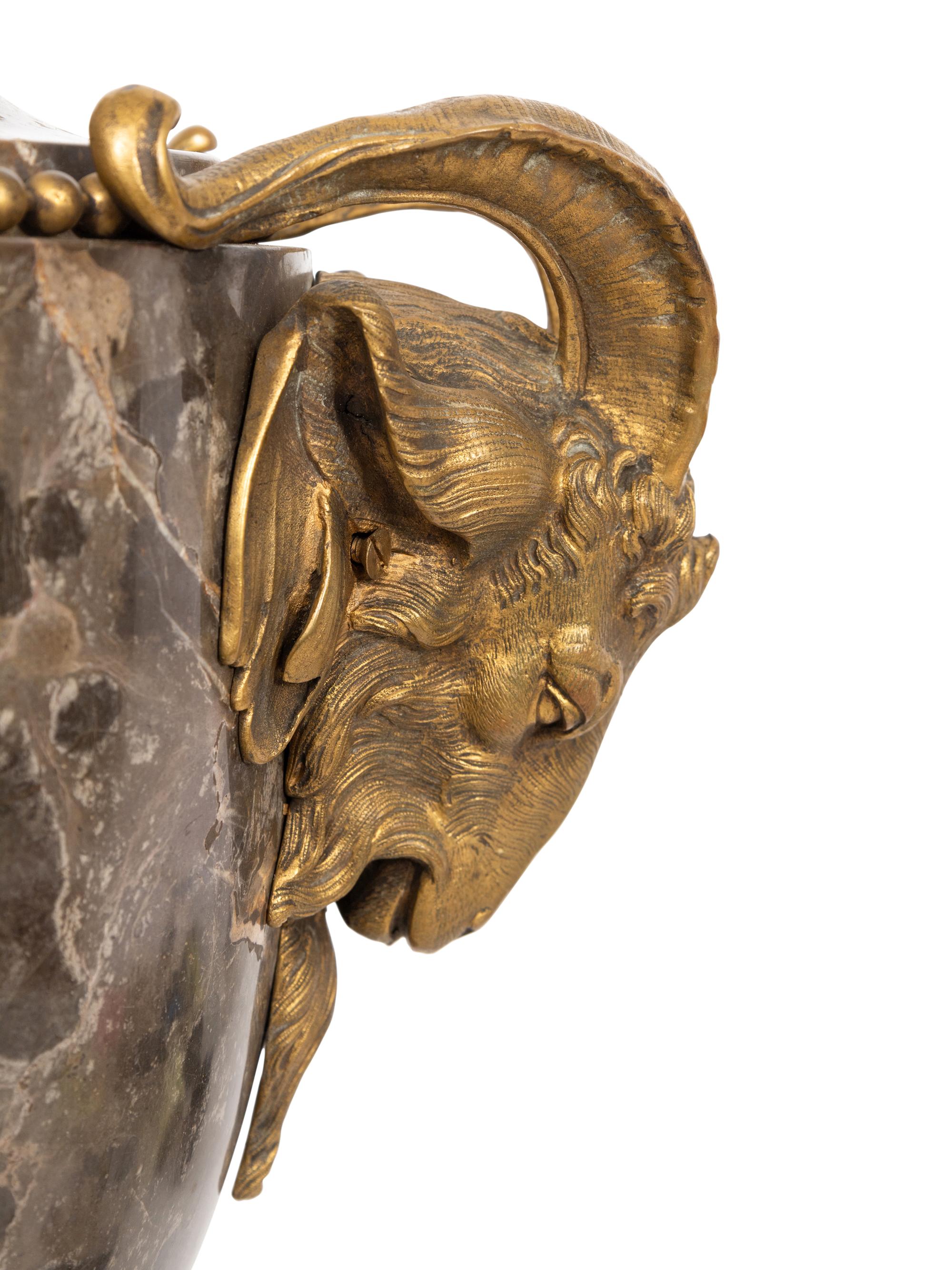 A Pair of French Gilt Bronze Mounted Marble Urns