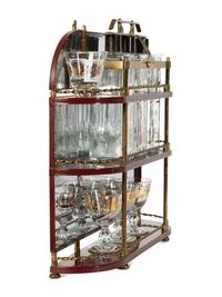 A Brass-Mounted Liquor Rack with Glasses and Tantalus