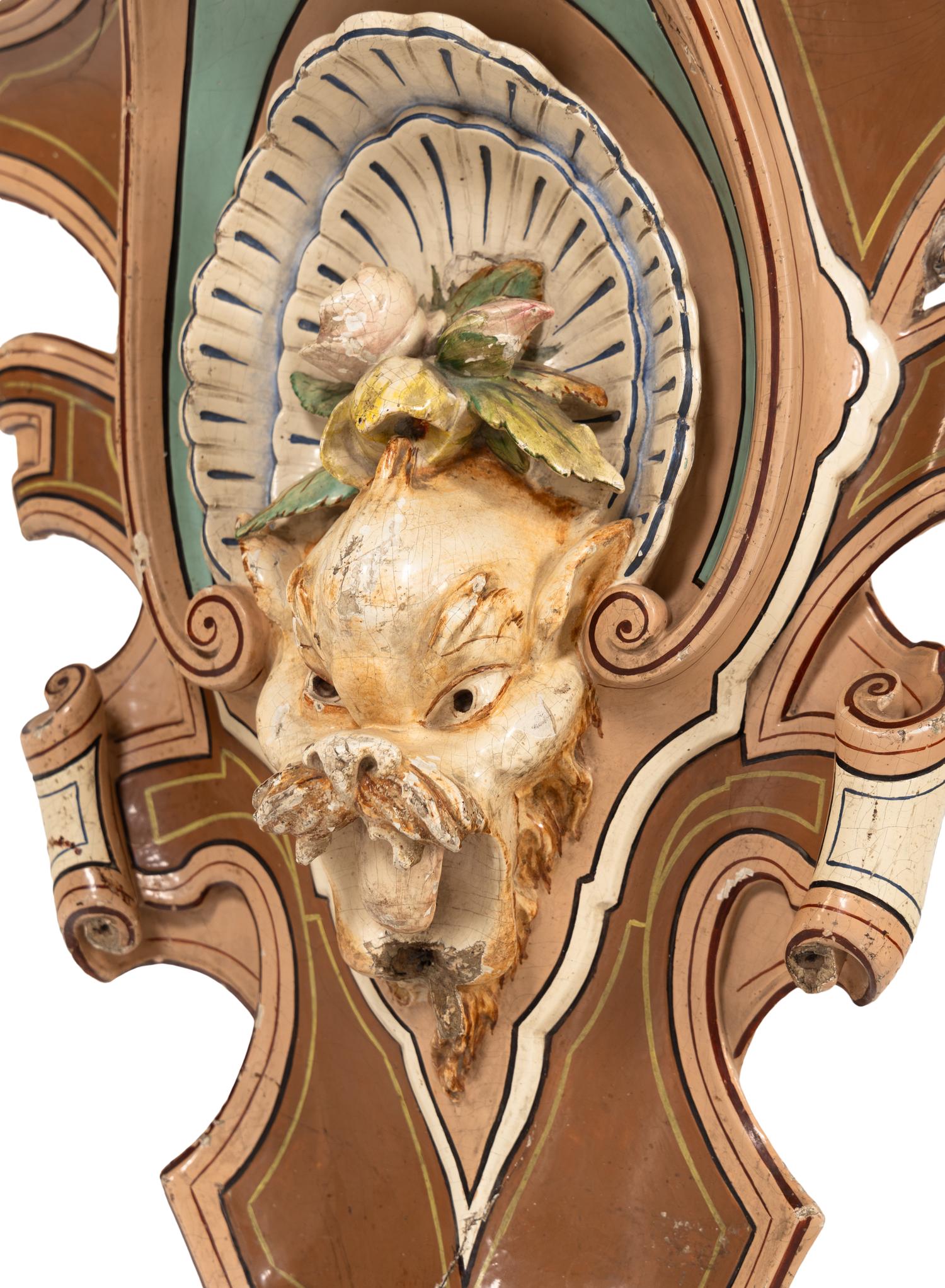 A Pair of Continental Carved and Painted Wood Wall Brackets