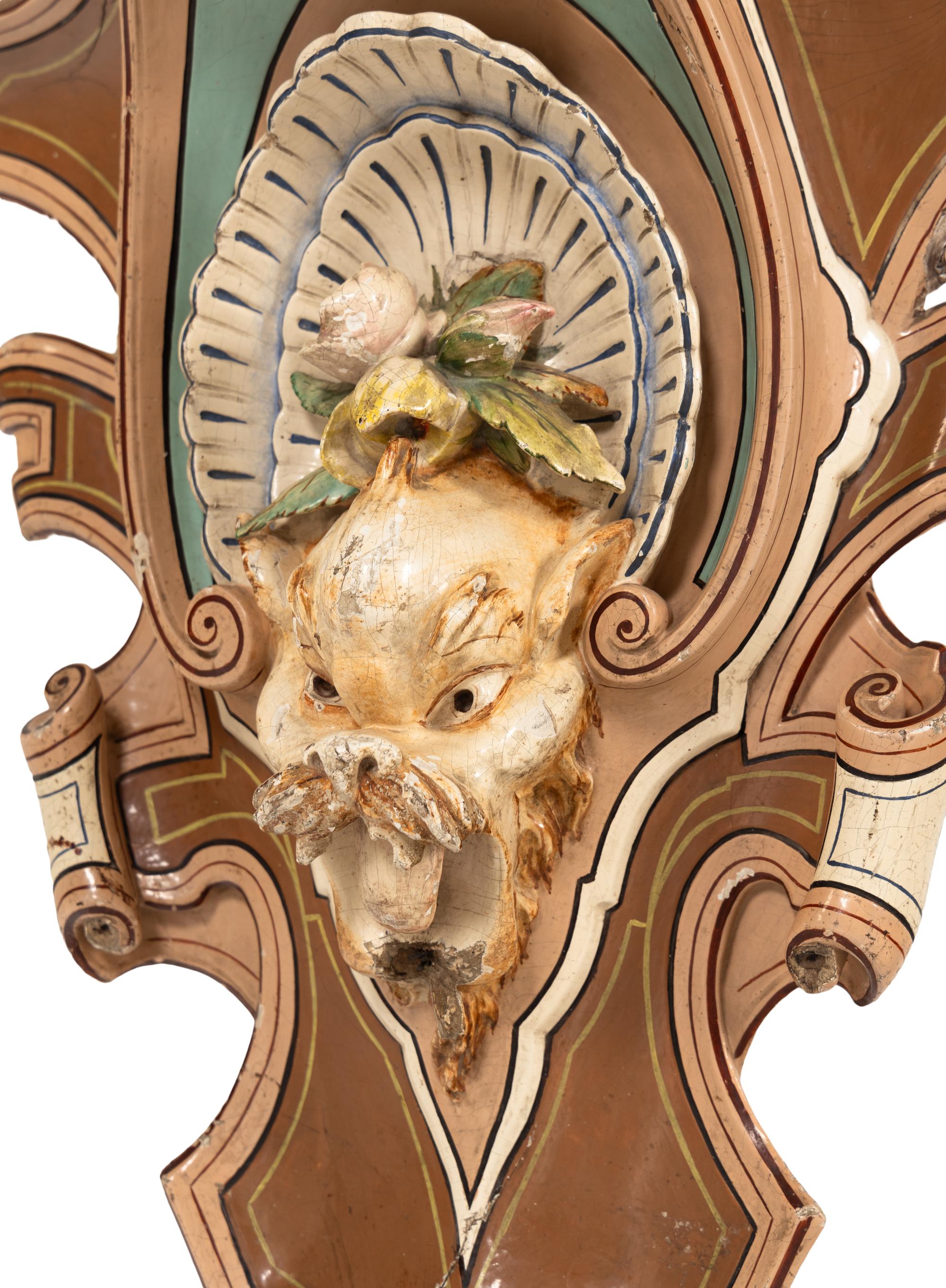 A Pair of Continental Carved and Painted Wood Wall Brackets