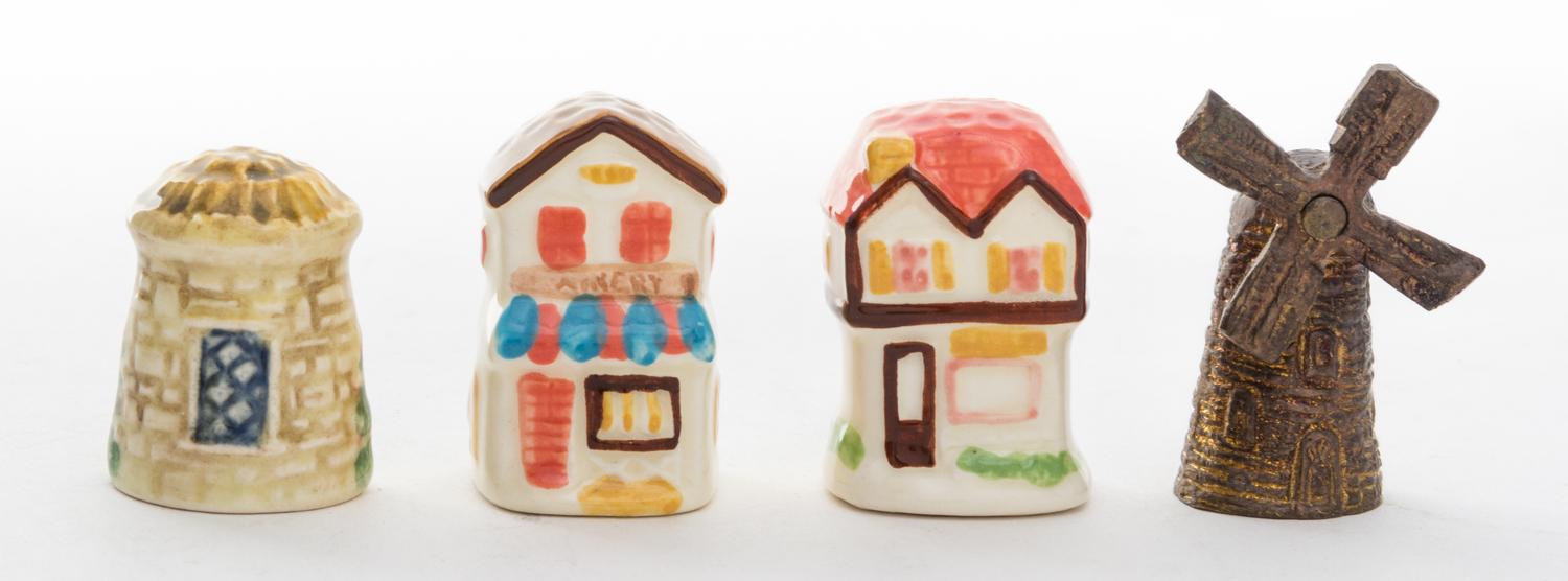 A Collection of Four Building Form Thimbles Height of tallest 1 1/2 inches,