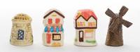 A Collection of Four Building Form Thimbles Height of tallest 1 1/2 inches,