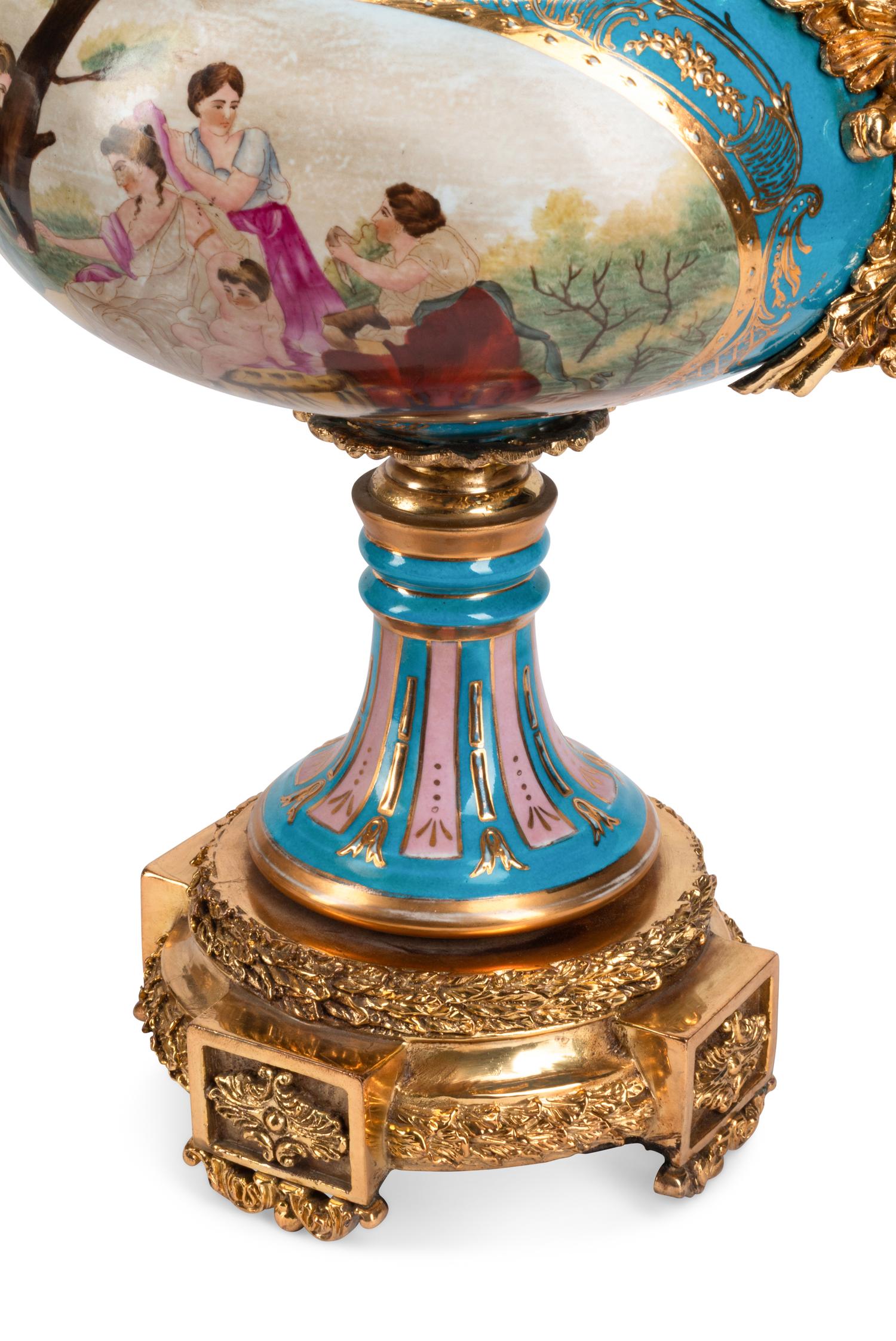 A Pair of Gilt Bronze Mounted Sèvres Style Porcelain Vases and Covers