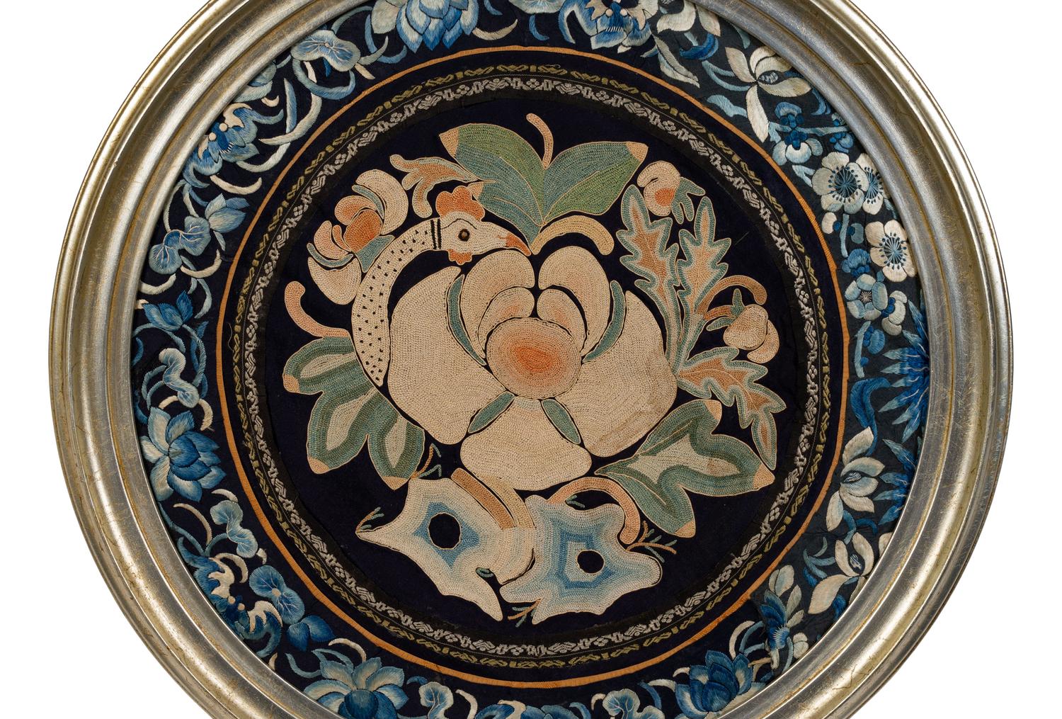 A Chinese Framed Blue Ground Embroidered Silk Panel Diameter 13 1/2 inches.