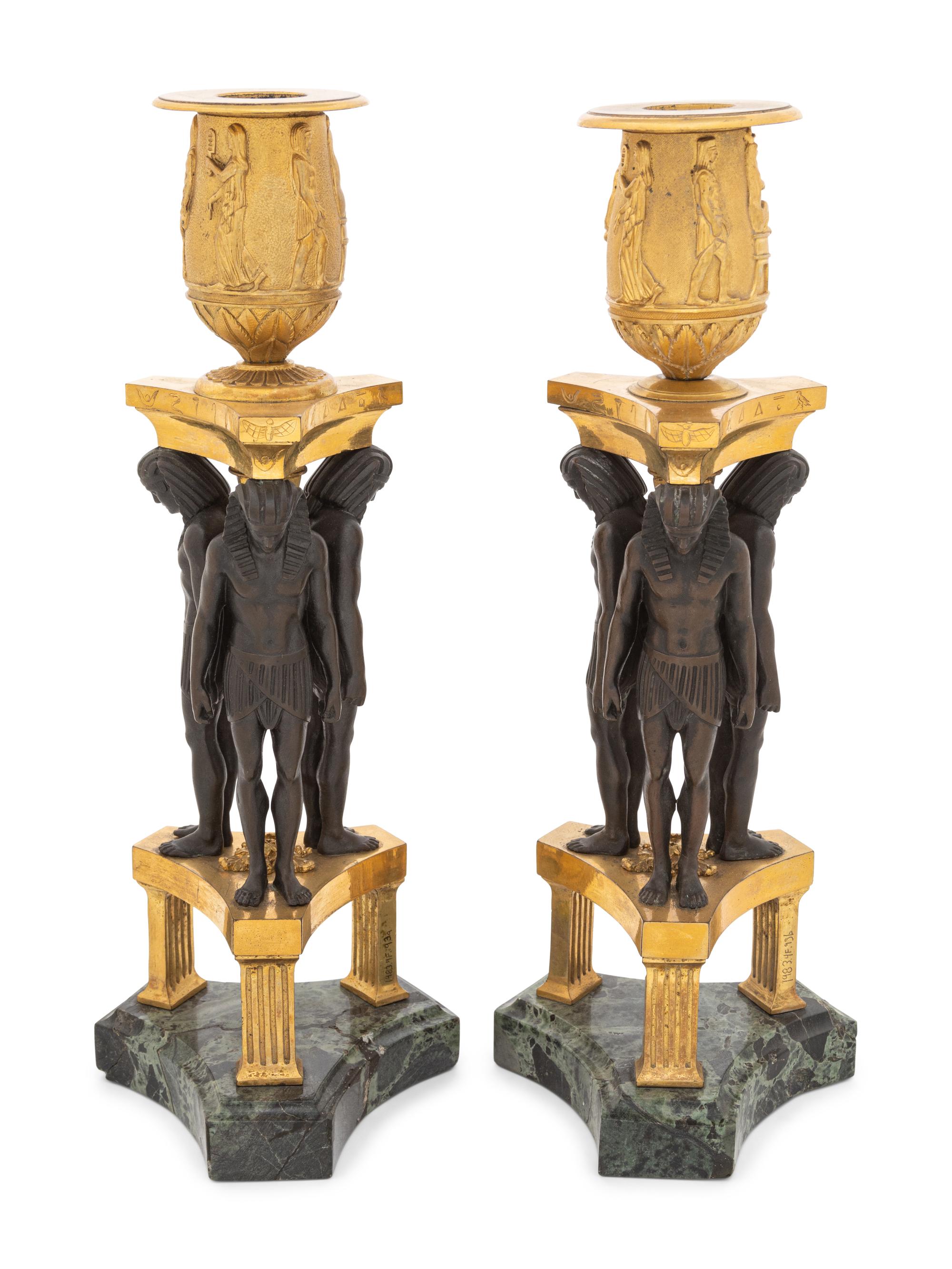 A Pair of French Egyptian Revival Bronze and Marble Candlesticks