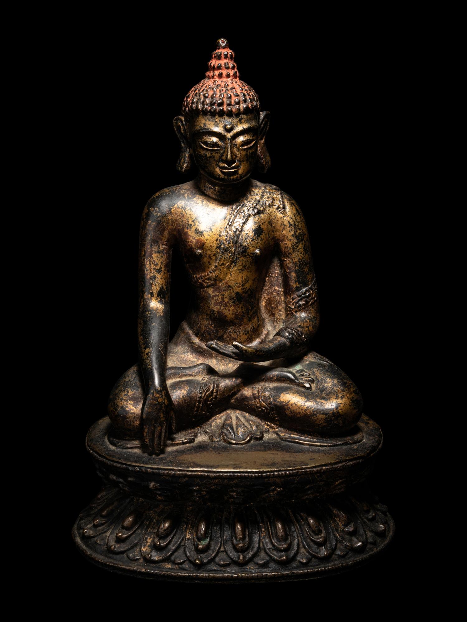 A Large Nepalese Gilt Bronze Figure of Seated Buddha